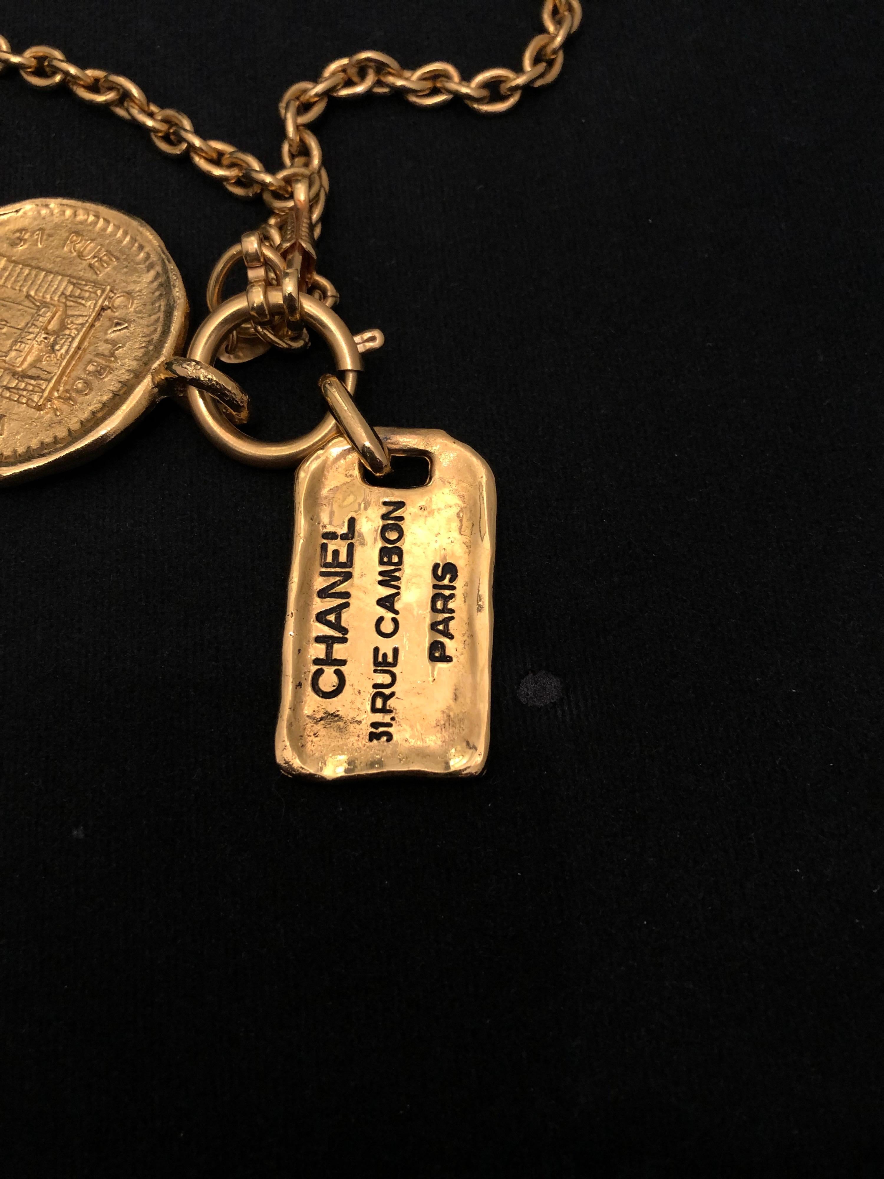 1980s Vintage Chanel Gold Toned 31 Rue Cambon Charm Necklace  2
