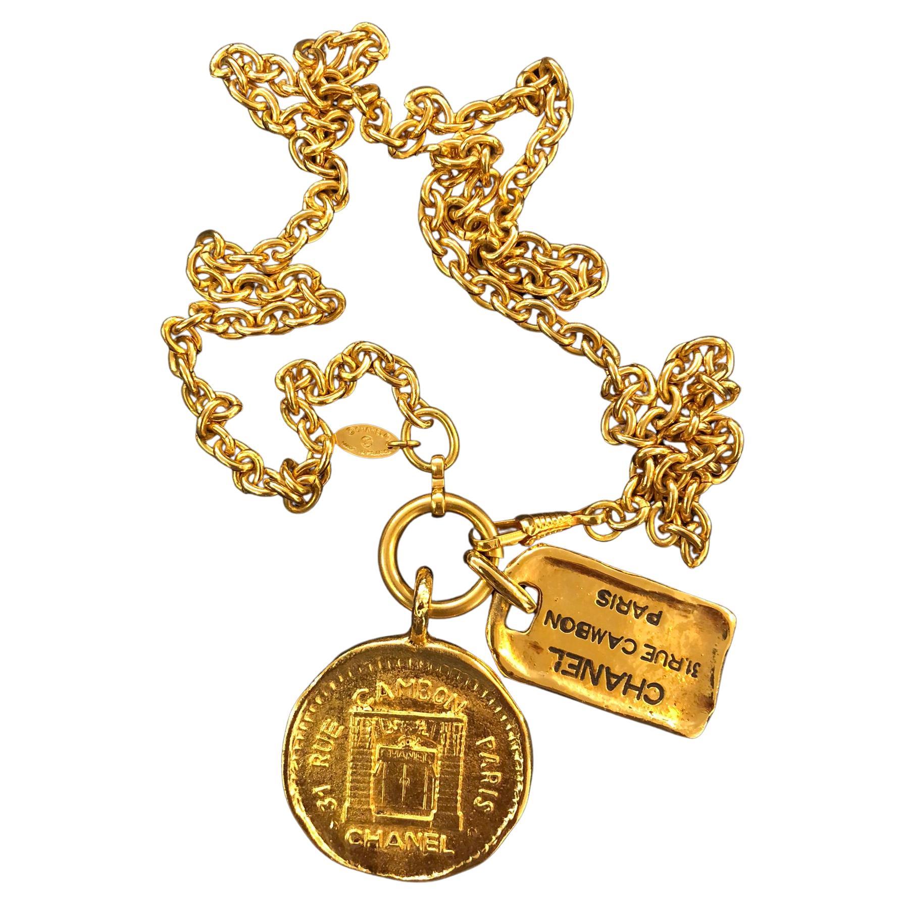 1980s Vintage Chanel Gold Toned 31 Rue Cambon Charm Necklace 