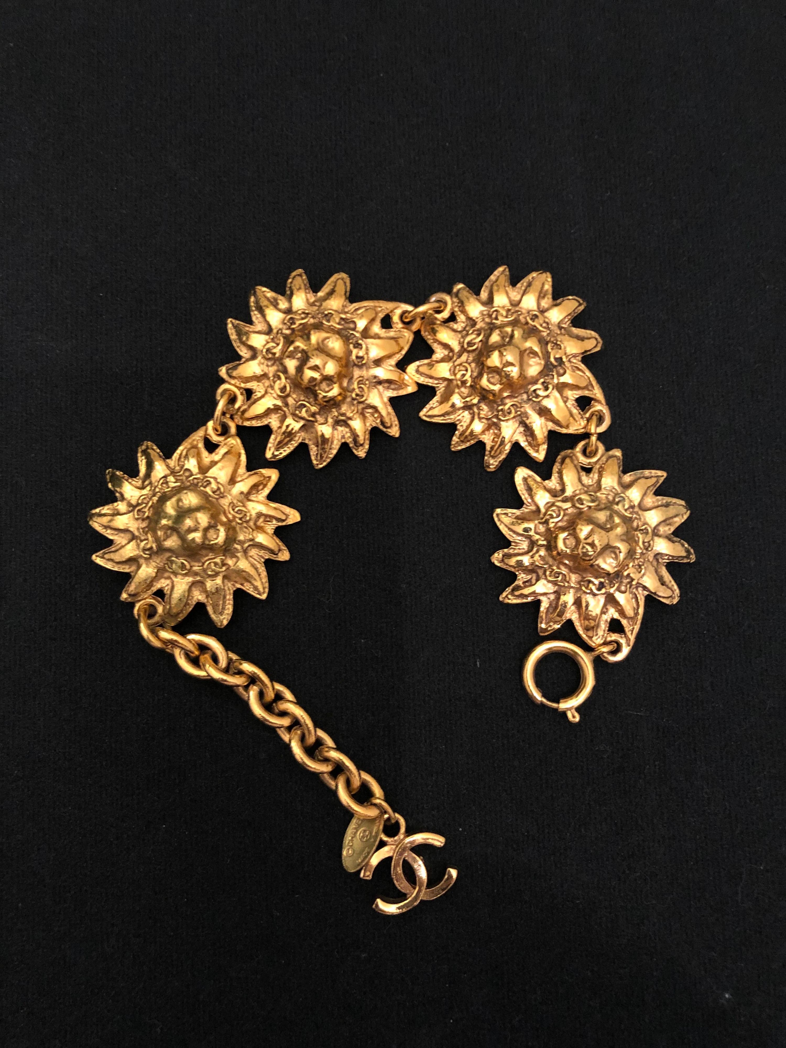 1980s Chanel gold toned lion chain bracelet featuring four lion heads adorned with seven CC logos around each lion head. 

Proud and regal, the lion has been used a reflection of Gabrielle Chanel's own power and independence. It also evokes her love
