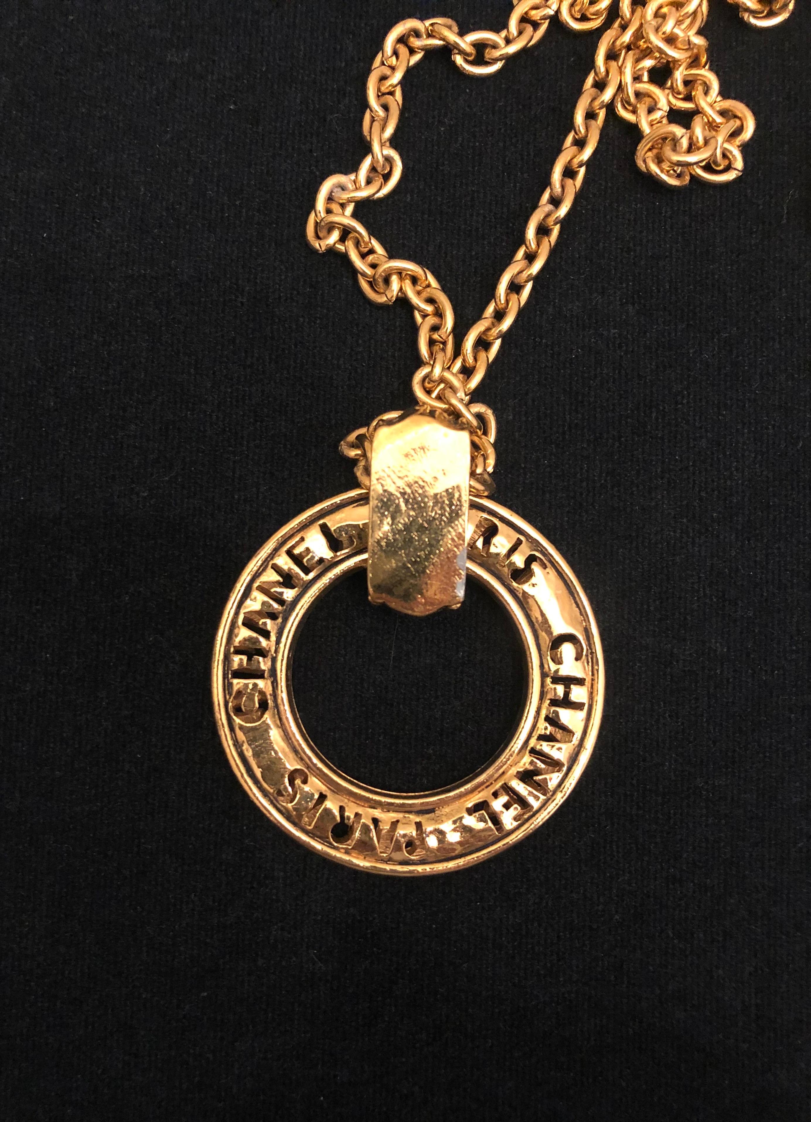 Women's or Men's 1980s Vintage Chanel Gold Toned Long Chain Necklace with Cut-Out Letter Ring
