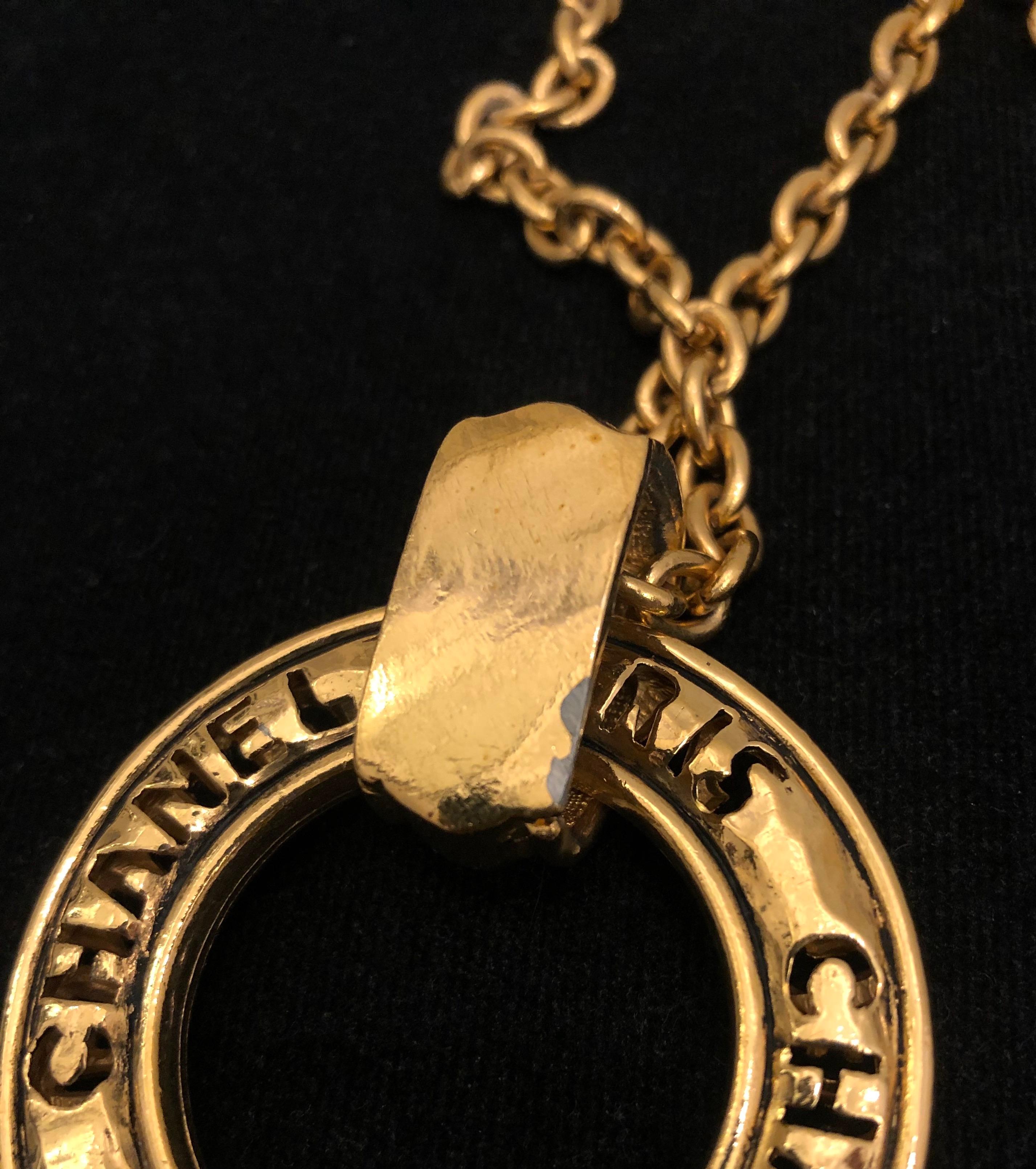 1980s Vintage Chanel Gold Toned Long Chain Necklace with Cut-Out Letter Ring 1