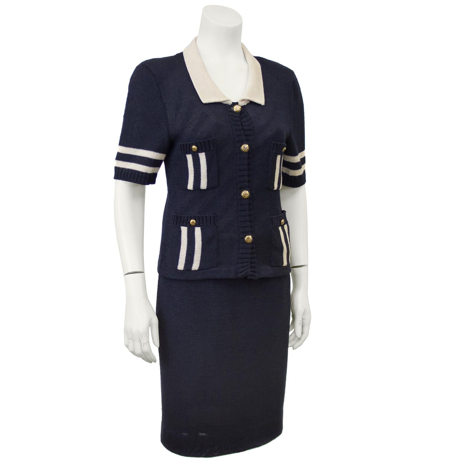 Perfect for the summer, this 1980s Chanel navy knit ensemble is amazing when worn together or 3 great pieces to add to any wardrobe. The short sleeve sweater jacket buttons up the front with goldtone CC Chanel buttons and is finished with a cream