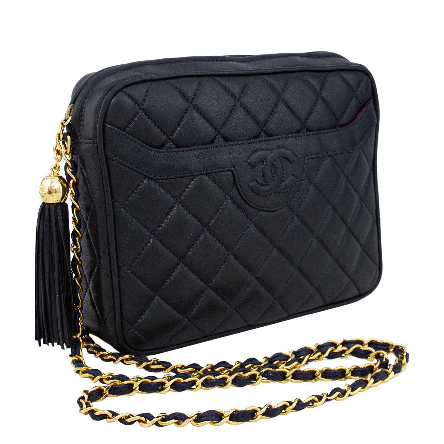 Classic is classic, and a Chanel camera bag never goes out of style. This bag dates from pre 1984 which is prior to serial numbers and hologram tags, and is the large version of the camera bag. Dark navy blue quilted lambskin leather with embossed