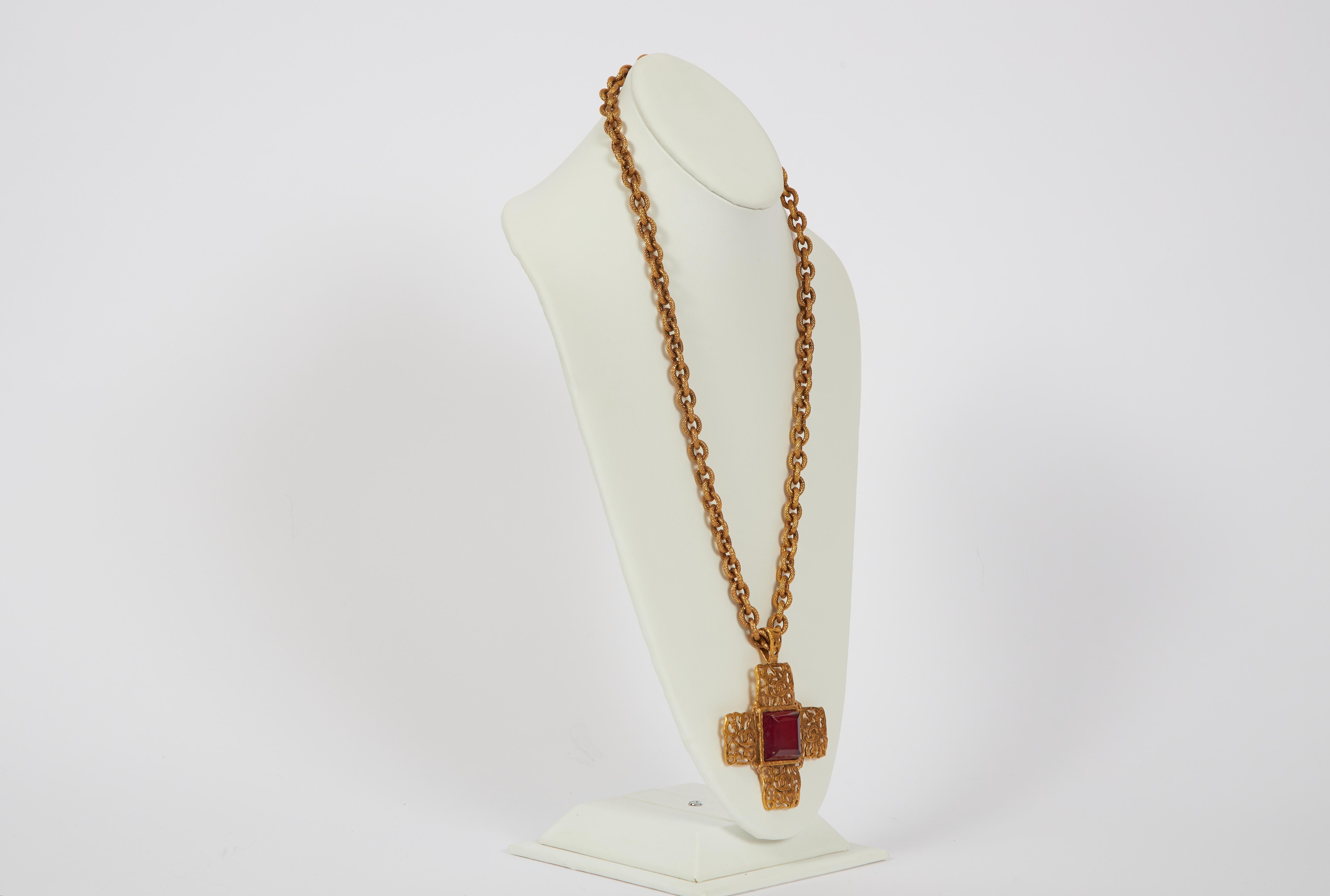 Chanel textured goldtone metal chain-link necklace featuring a cross pendant with a red gripoix center stone. Collection 25. Pendant, 3.5