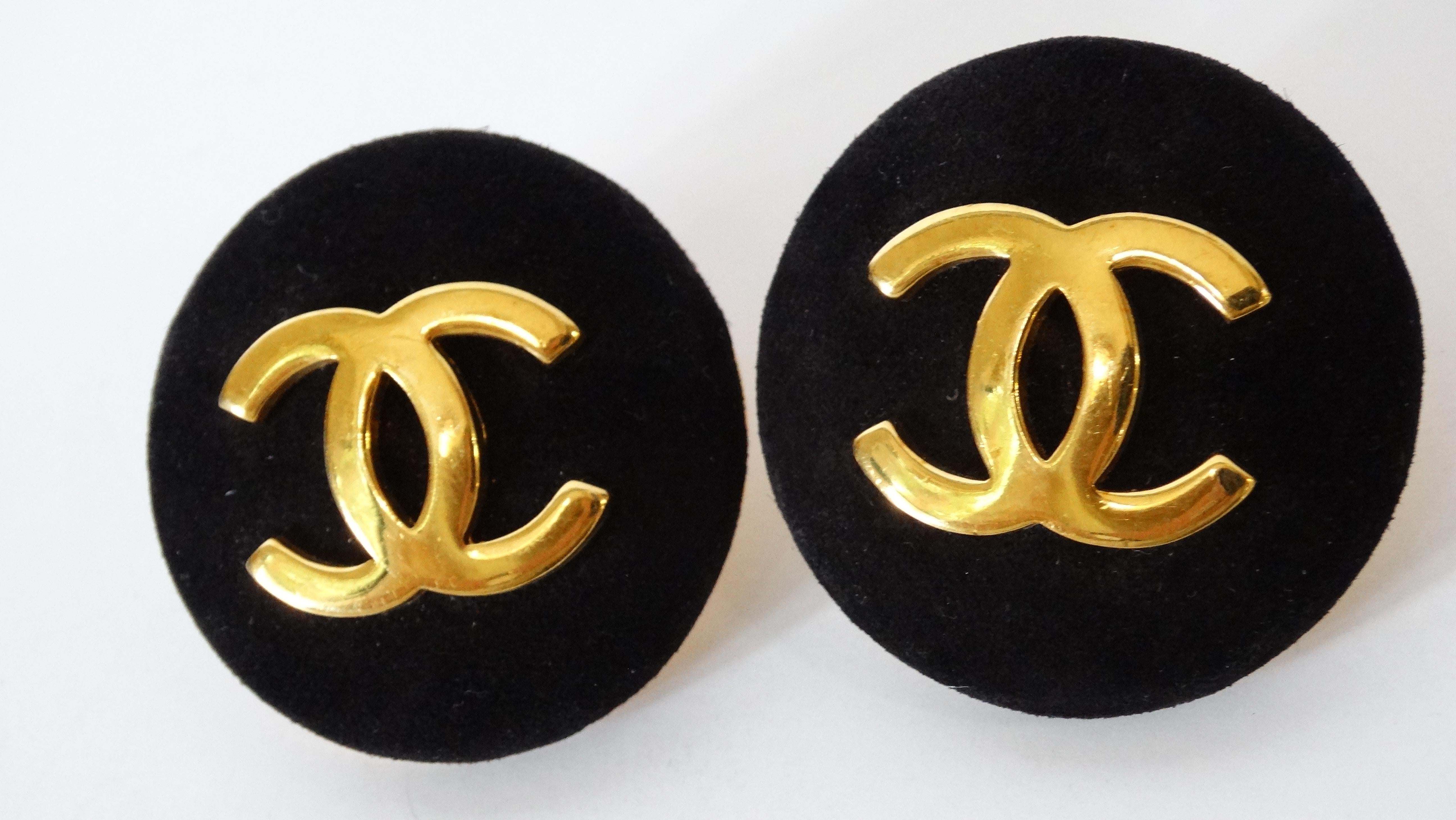 Everyone needs a pair of Chanel button earrings in their collection-and we have the perfect pair for you to snag! Circa 1980s these adorable Chanel earrings are crafted from soft black suede and feature the signature Chanel 