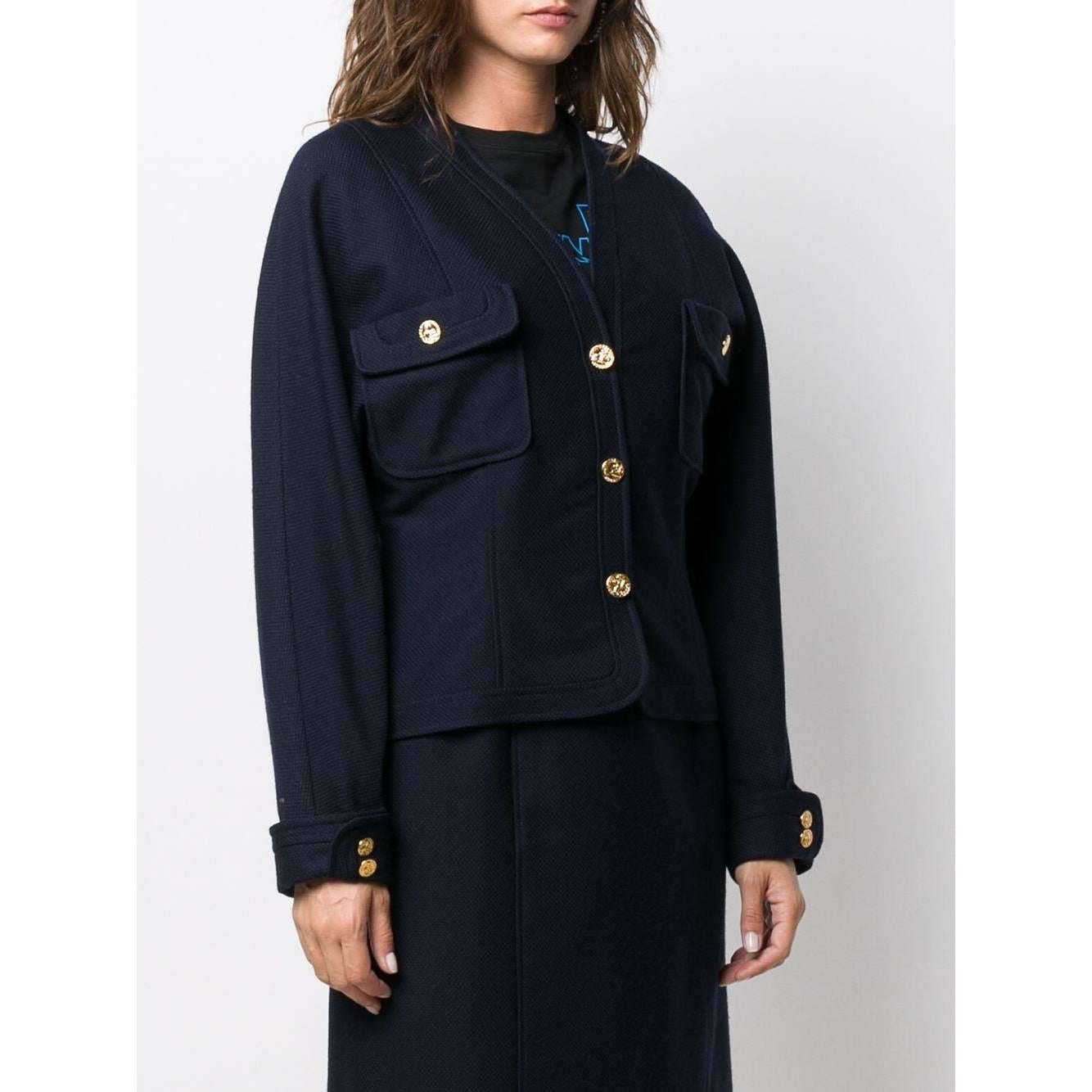 A.N.G.E.L.O. Vintage - ITALY 
Chanel blue wool fitted jacket. V-neck, front closure with golden buttons. Long sleeves, patch pockets with flap.

Years: 80s

Made in France

Size: 38 FR

Flat measurements

Height: 54 cm
Bust: 45 cm
Shoulders: 43 cm