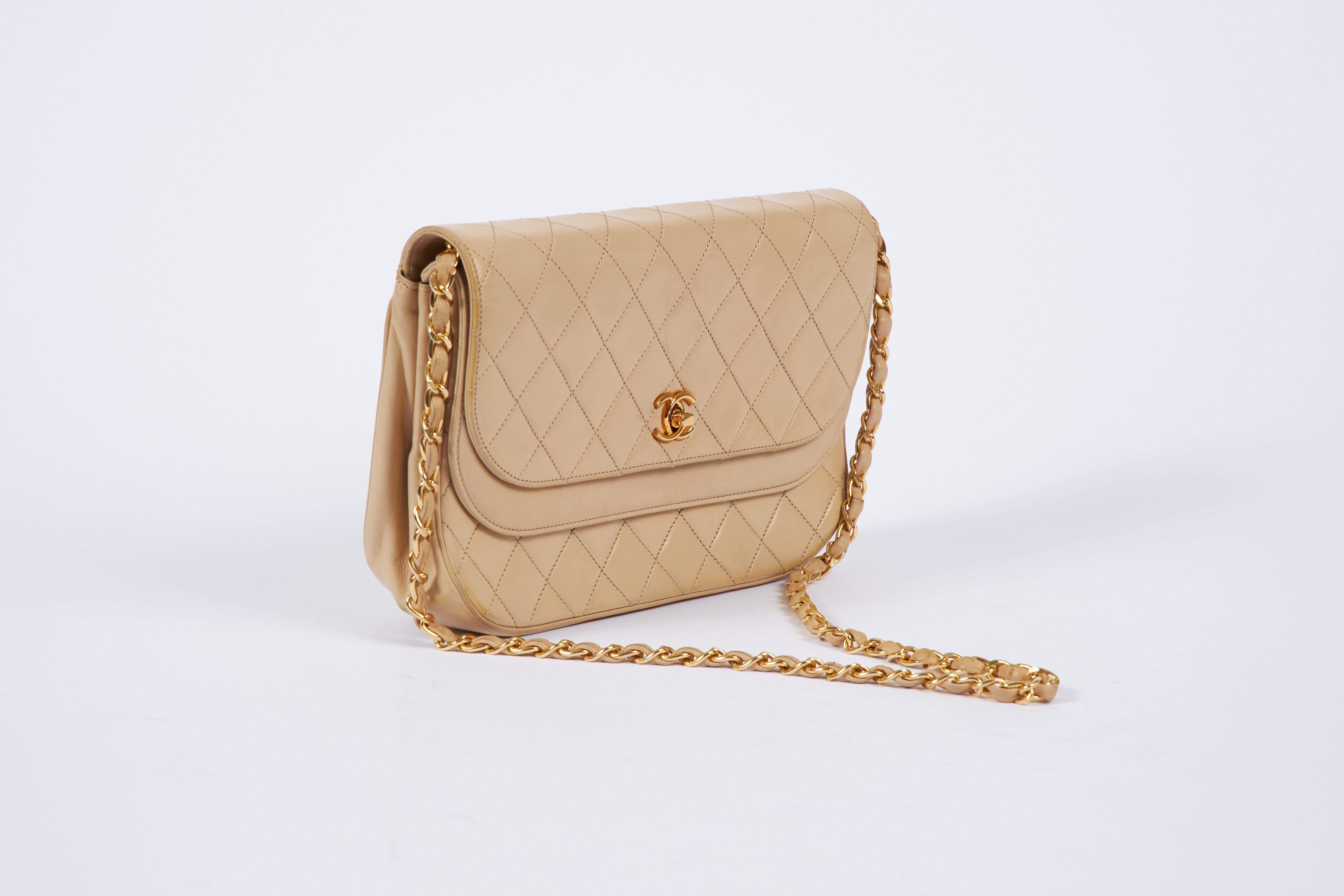 Chanel vintage 80s beige lambskin double flap with gold tone hardware. Comes with original dust cover.