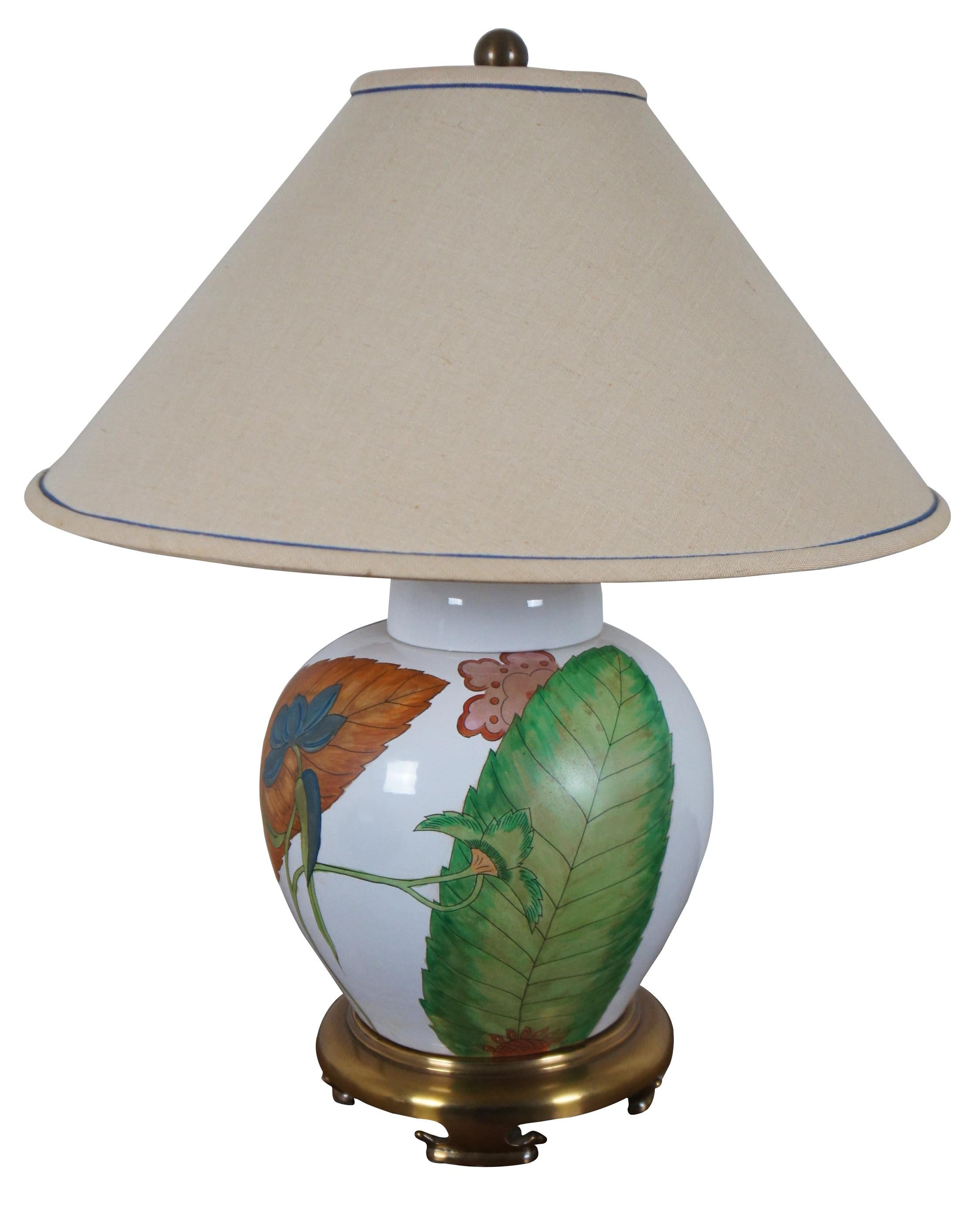 Vintage Chapman ginger jar table lamp circa 1980’s; white glazed porcelain with orange, blue, pink and green matte painted leaves and flowers, brass base and finial.

Measures: 11” x 18.5” / Shade - 21.25” x 9.5” / Height to Top of Finial – 26.5”
