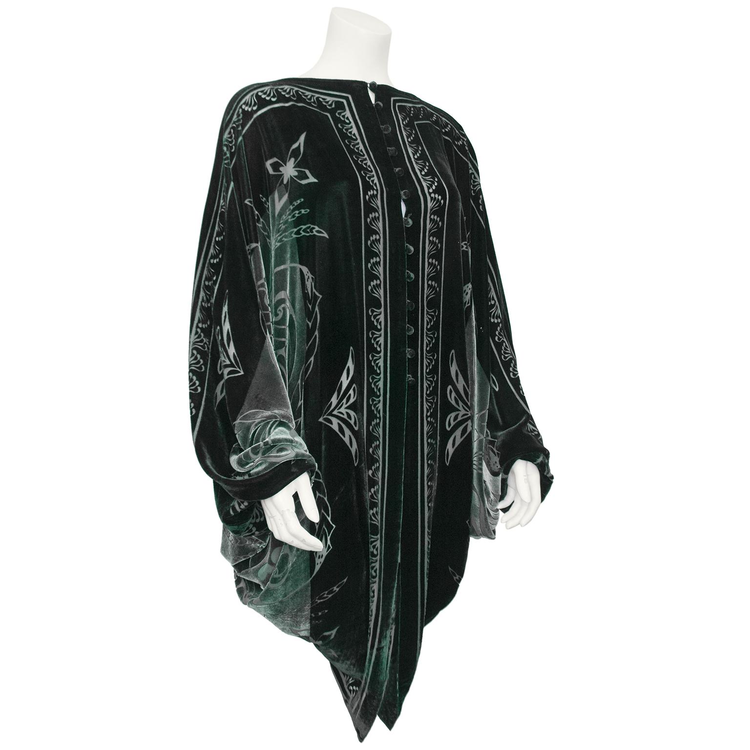 Welsh Designers Charles & Patricia Lester were known for their love of unique handcrafted textiles, and this oversized cardigan/capelet is no exception. Black, grey and dark green devore velvet with art deco inspired designs throughout. Lined in a