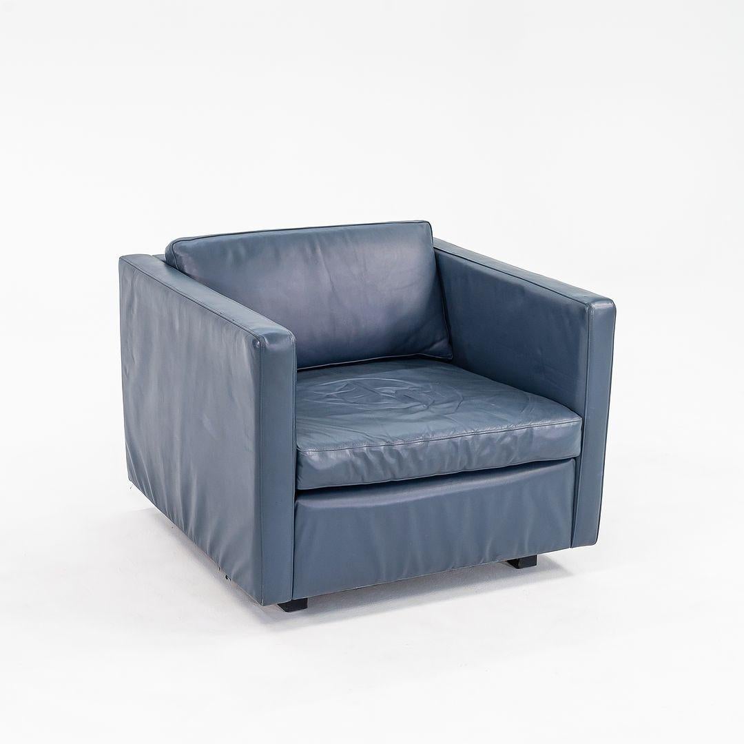 This is a Pfister Lounge Chair, model 1051C, originally designed by Charles Pfister in 1971. This example dates to the 1980s. The design features a steel frame with plywood inserts, and a fully upholstered seat and back. The original upholstery is