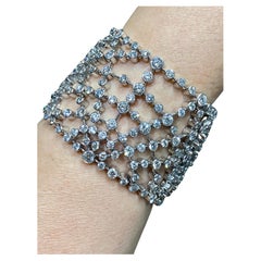 1980s Chaumet 18k gold and diamond cobweb bracelet in its original box