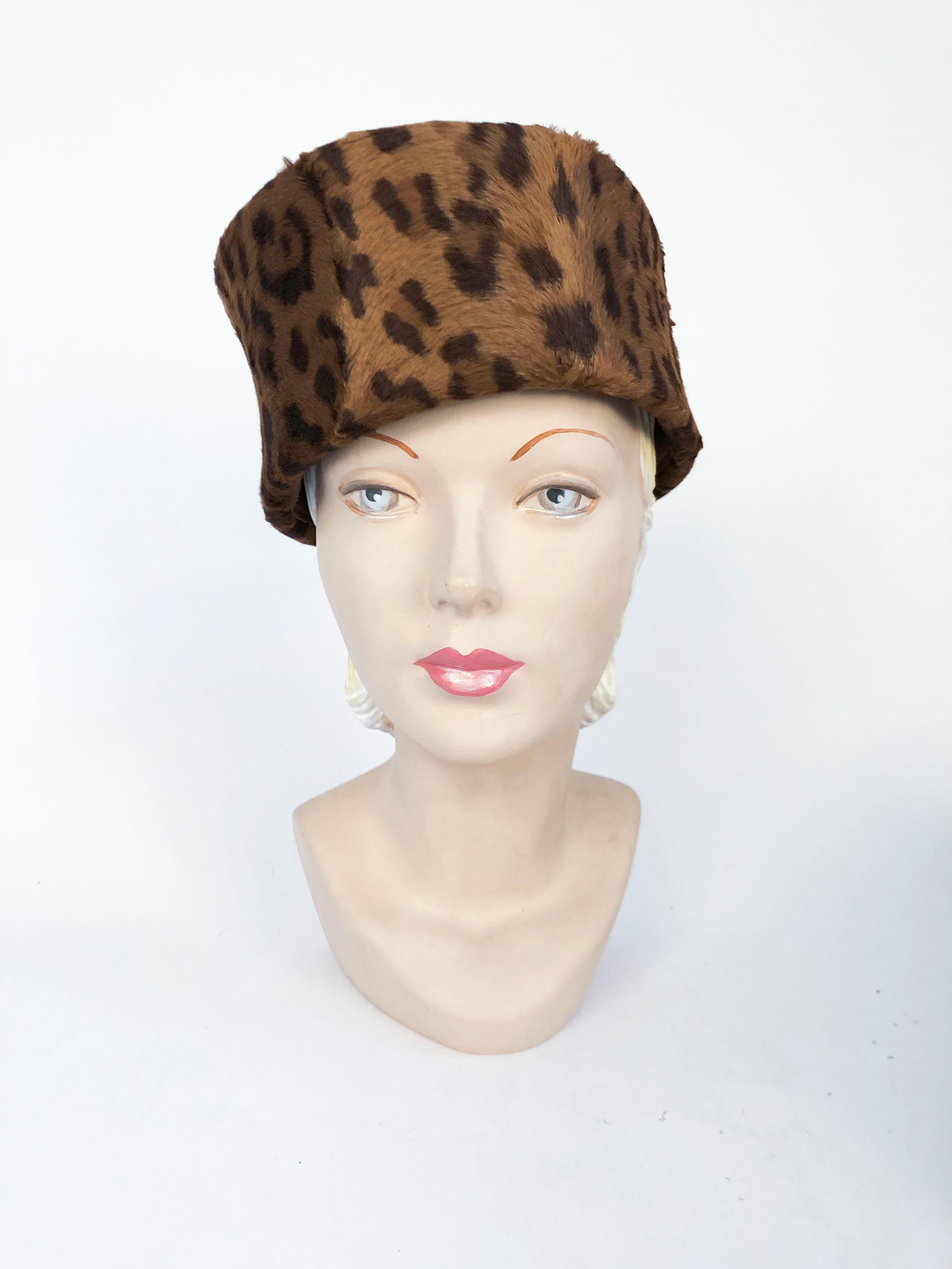 1980's Cheetah Print Pillbox Hat with Matching Gloves. This cheetah printed hi-pile fabric pillbox hat features natural texture that imitates genuine fur. It also has matching gloves that have gauntlet style cuffs.