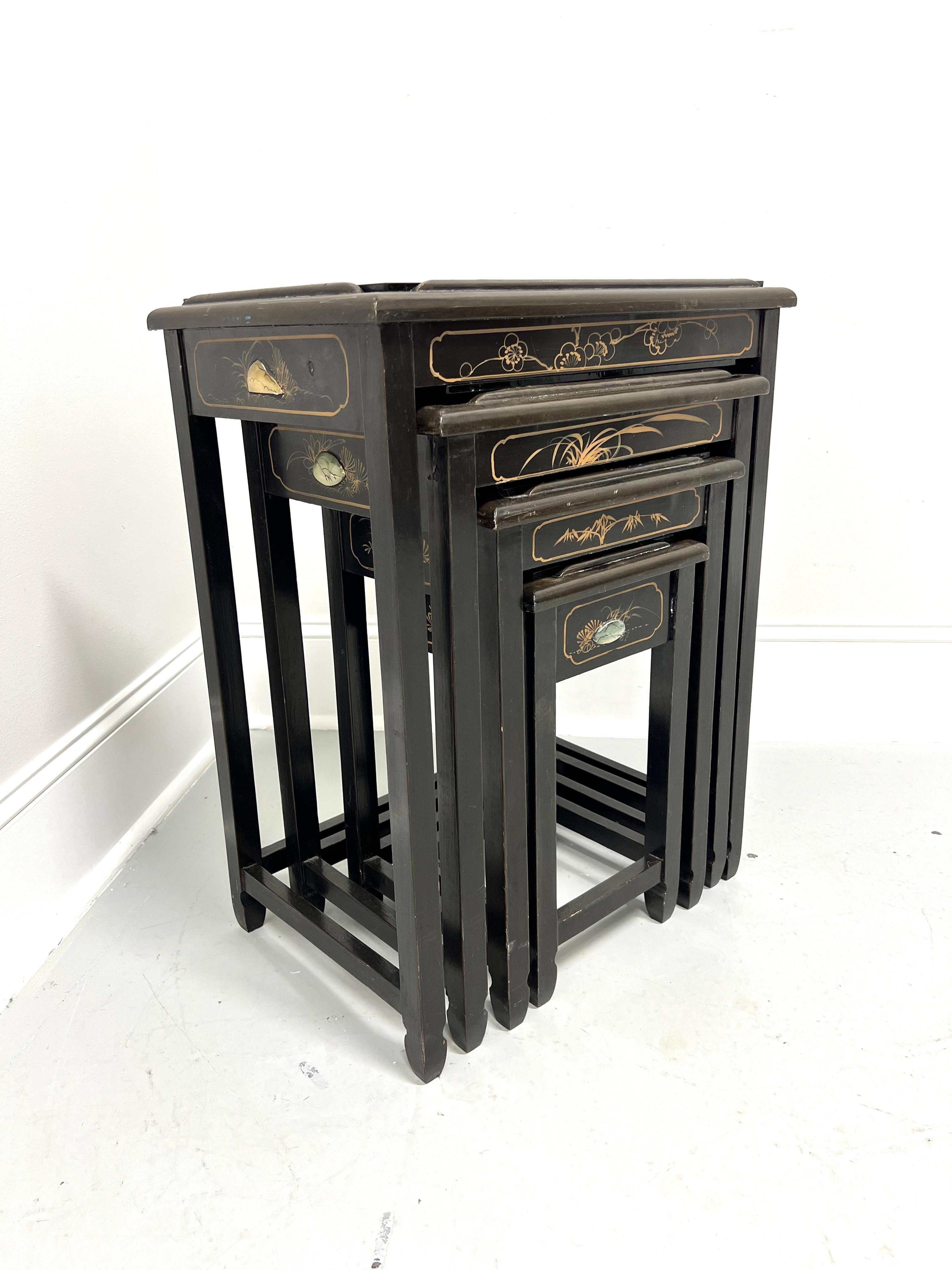A set of four hand painted Chinese Export Asian style nesting tables, unbranded. Solid wood with black lacquer, tops are recessed with painted traditional Chinese ladies, protective glass top, painted design to aprons, turned inward legs and