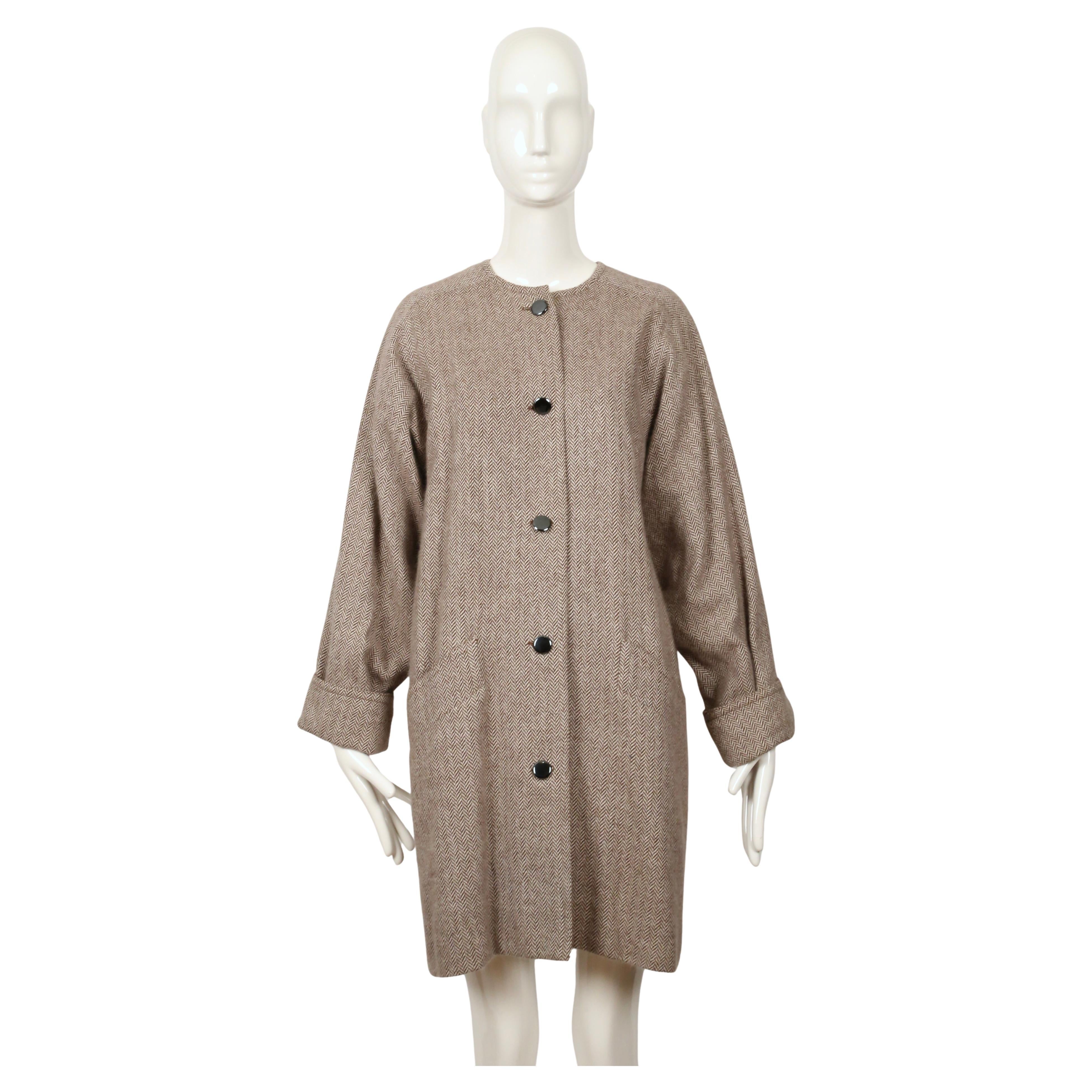 Very soft taupe and cream herringbone coat made of cashmere with hematite toned buttons designed by Karl Lagerfeld for Chloe dating to the 1980's.  There is no size label but this best fits a US 2-6. Approximate measurements: bust 42.5