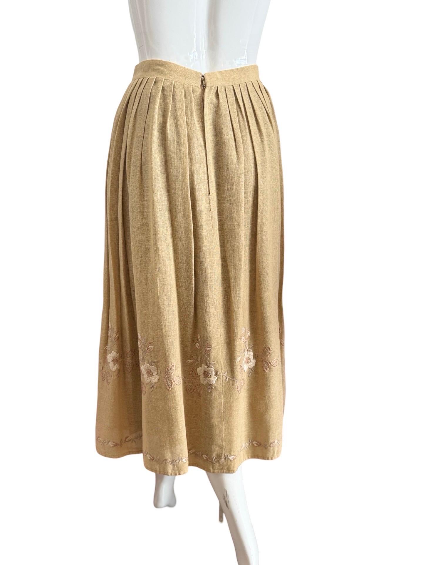 Gorgeous French countryside look. 1980s Chloe flax cotton embroidered set with coordinated tan top and floral embroidered midi skirt.  The top has dolman sleeves with button closures at the waist.  The skirt is high-waisted with a  pleated skirt and