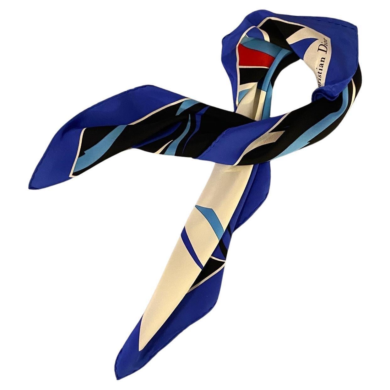 This timeless Christian Dior piece is a luxurious way to make any outfit pop. Indulge your senses with the soft, yet durable, fabric of this striking multicolor scarf (blue, baby blue, red and white)

Condition: 1980s, vintage, very good, minimal