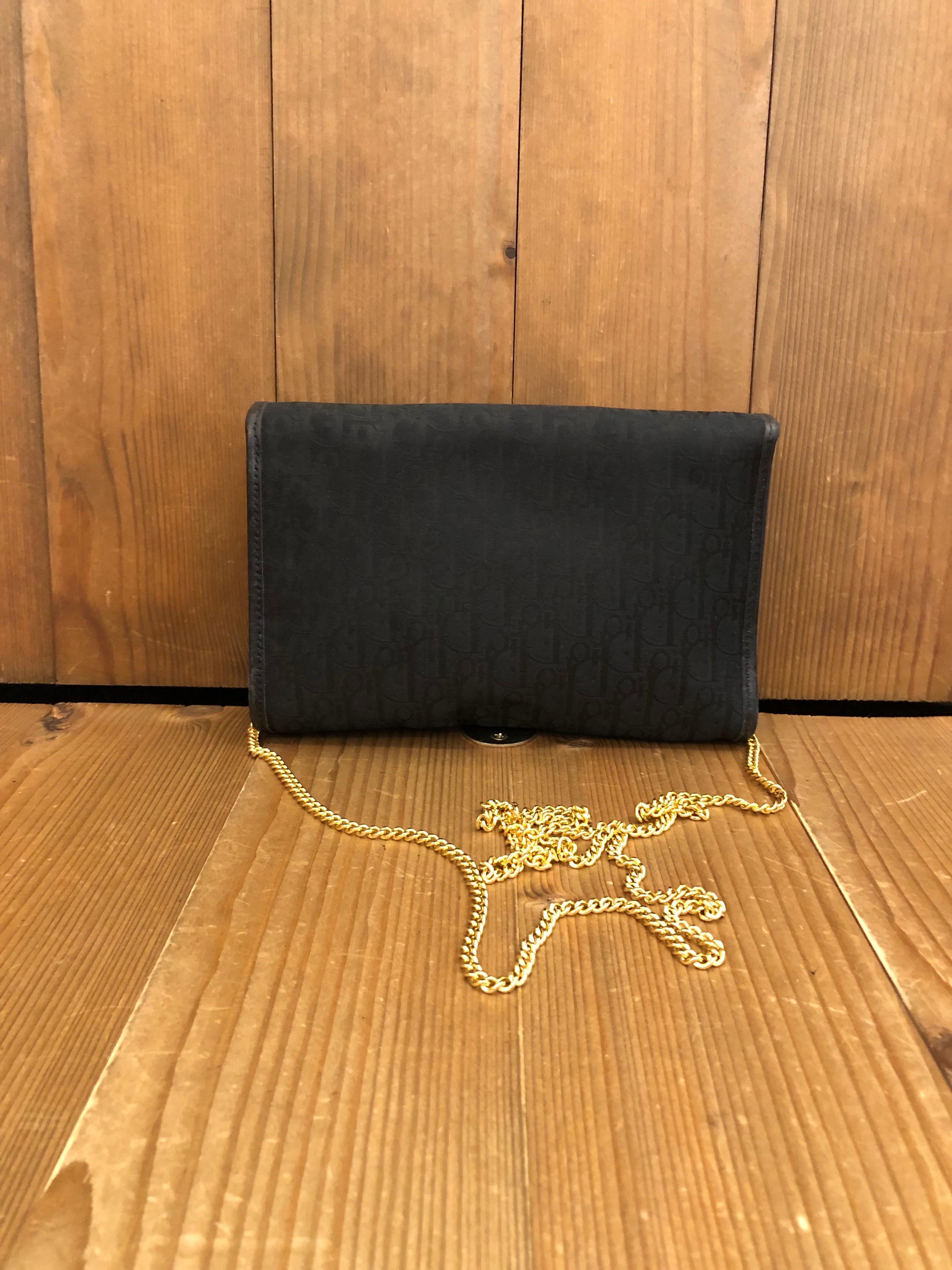 Vintage Christian Dior mini chain bag in black trotter jacquard. It can be worn double-chained as a shoulder bag or single-chained as a crossbody. Snap fastening, Made in France. Measures 7.5 x 5 x 1.25 Chain drop 22 inches (fits plus-sized