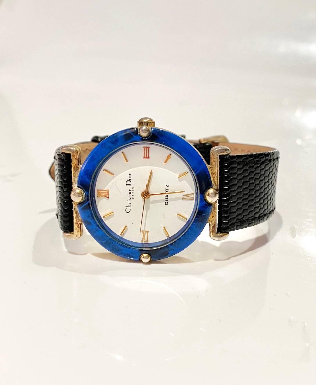 Vintage Christian Dior quartz watch, blue stone round face, Roman numbers, gold tone, water resistant, blue leather strap (replacement)

Condition: good vintage, 1980s, fully working, small sign of wear on glass as visible on pictures