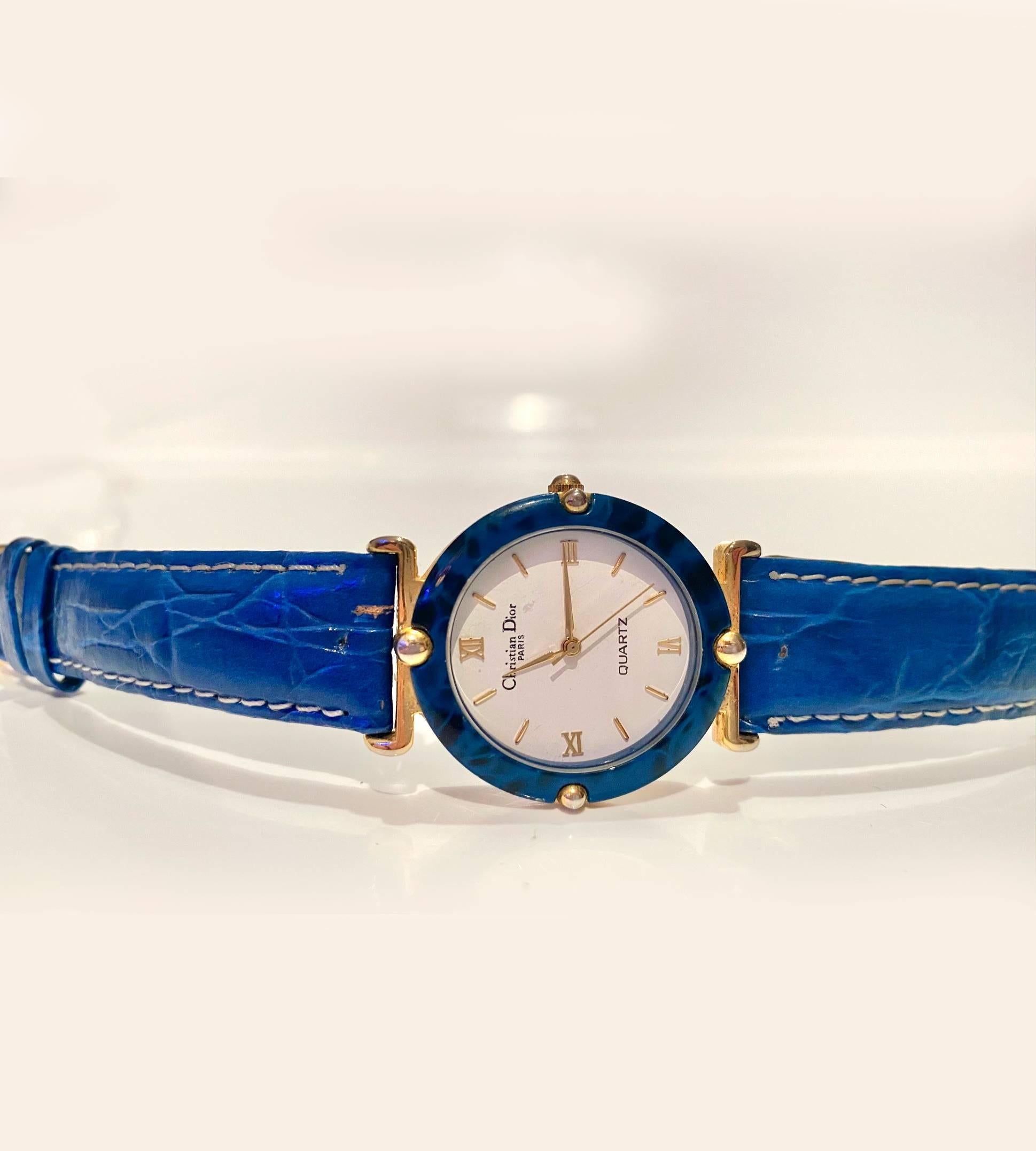 Vintage Christian Dior quartz watch, blue stone round face, Roman numbers, gold tone, water resistant, original blue leather strap signed Dior 

Condition: very good vintage, 1980s, fully working, slight wear on strap, barely visible 

Measurements: