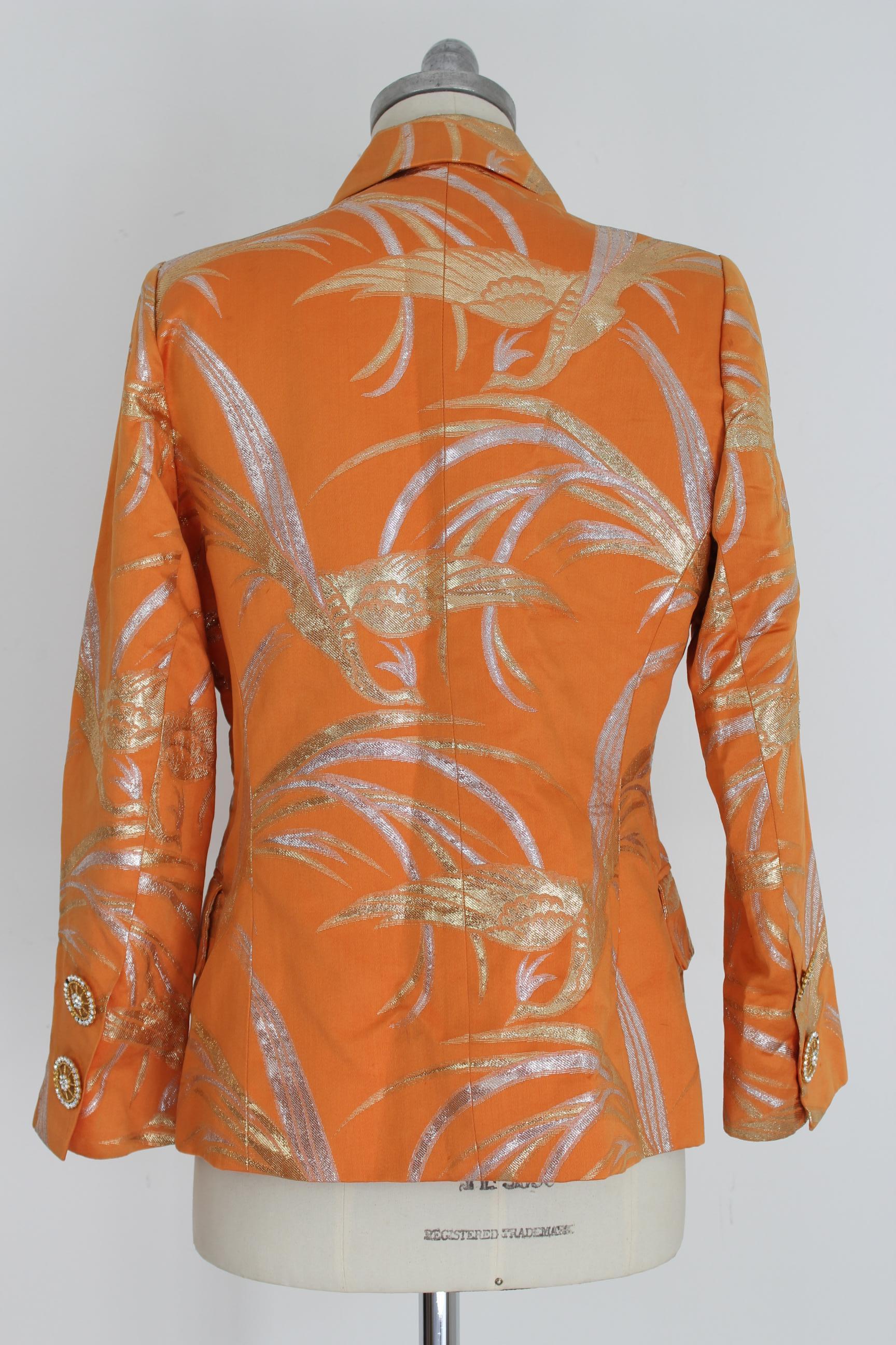 Christian Dior Boutique vintage 80s women's jacket. Evening blazer, short model double-breasted, color orange with floral designs lamè silver and gold . 100% Silk Chanto. Jewel buttons with swarosky . Made in France. Excellent vintage conditions.