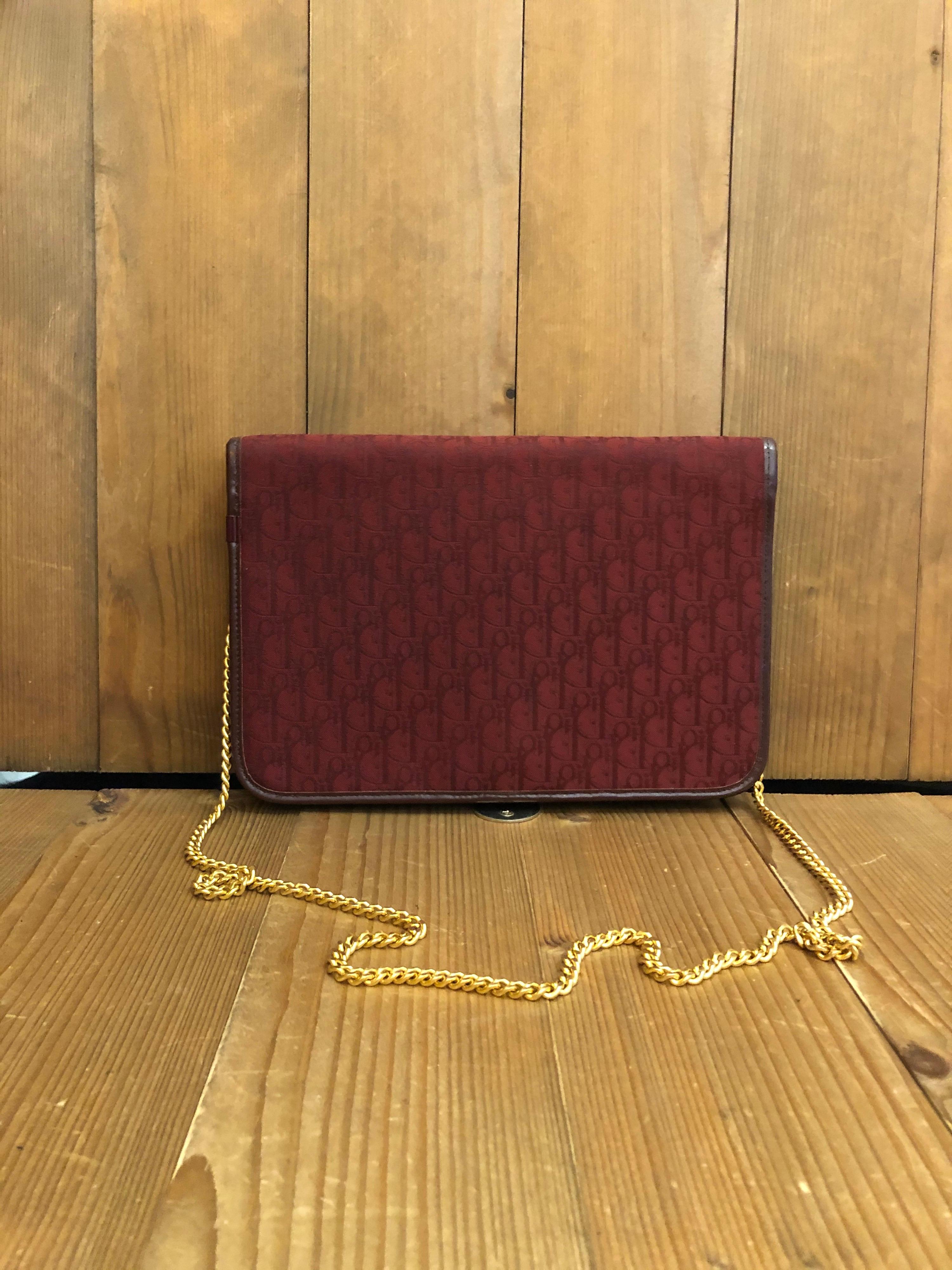 Christian Dior chain bag in burgundy Dior trotter jacquard featuring a huge CD logo on the front. Interior lined with burgundy leather. Made in France. Measurement 24.5 x 15.9 x 2.5cm Chain drop 39cm

Condition: Minor signs of use. Generally in very