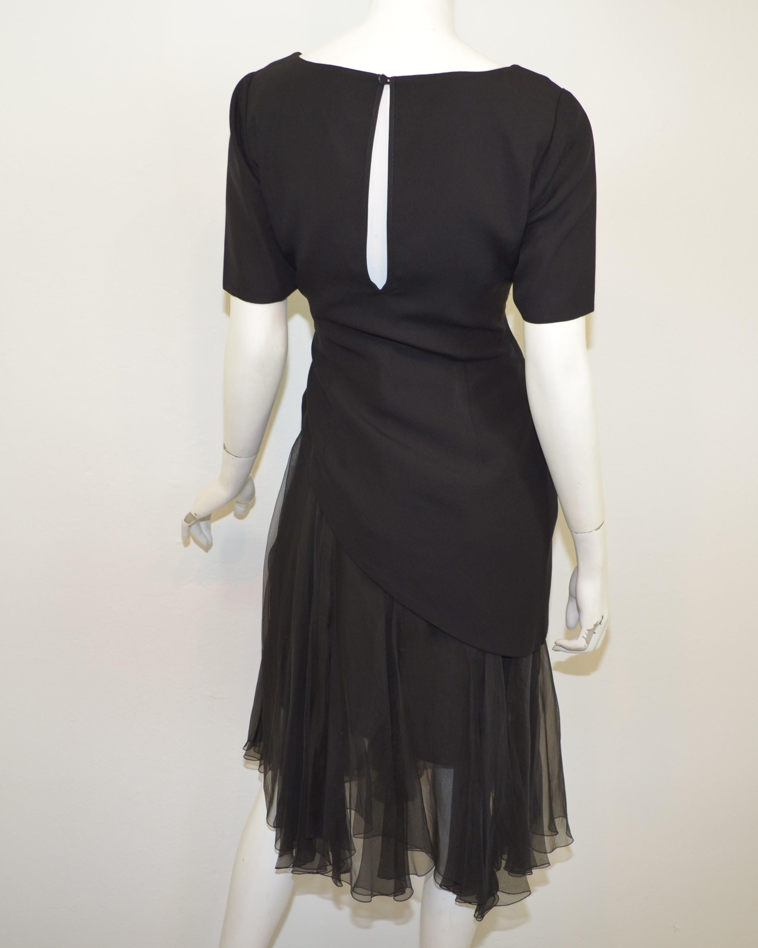 Late 1980's Christian Dior Boutique chiffon skirt with separate asymmetrical fitted bodice in black crepe. The ensemble has a numbered label and handwritten tag identifying the collection as 41C. Made in France.

Measurements:
Top - bust 36”,