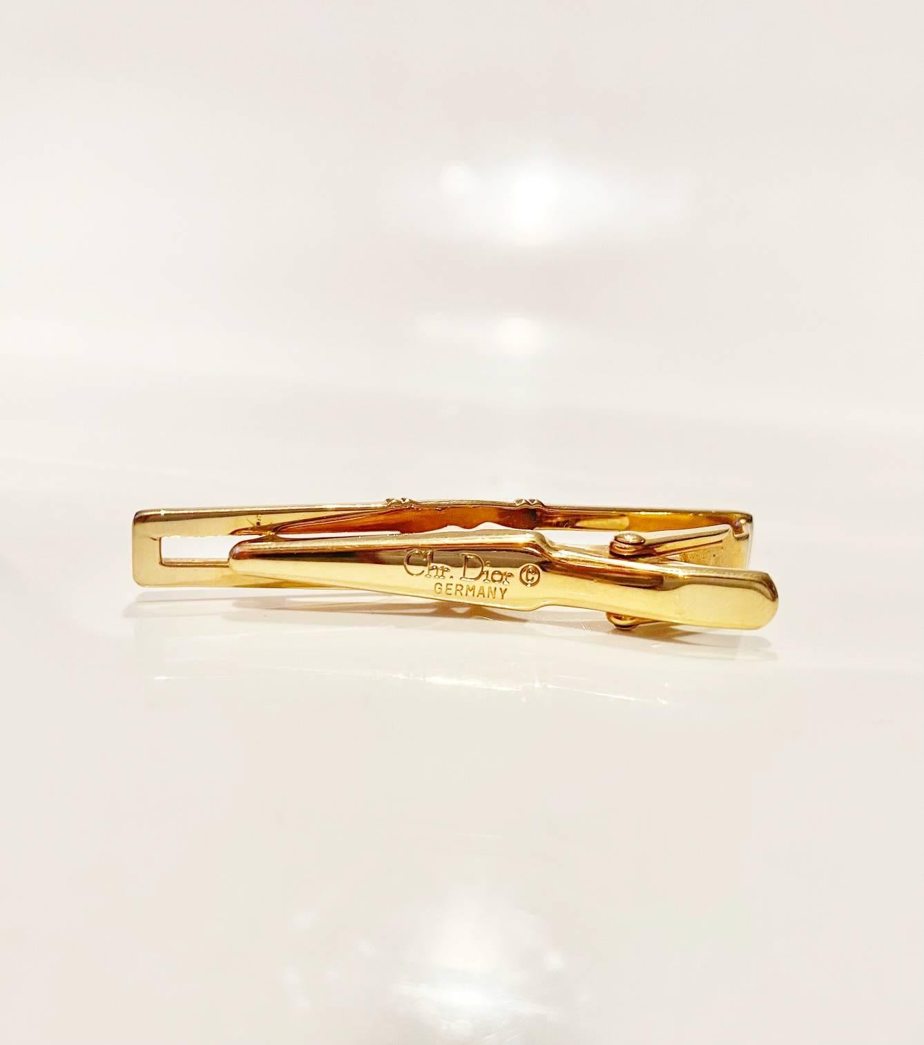 Gold plated Christian Dior tie / hair clip, Dior raised on the front, the back signed 
