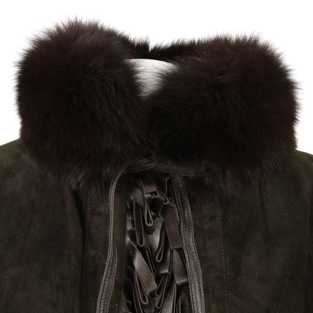 A.N.G.E.L.O. Vintage - Italy

Beautiful Christian Dior Boutique Cuirs greenish brown suede cape Coat trimmed with fox brown fur on the collar and the bottom, and fringed along the edges with brown leather listels.

The item is entirely opened on the