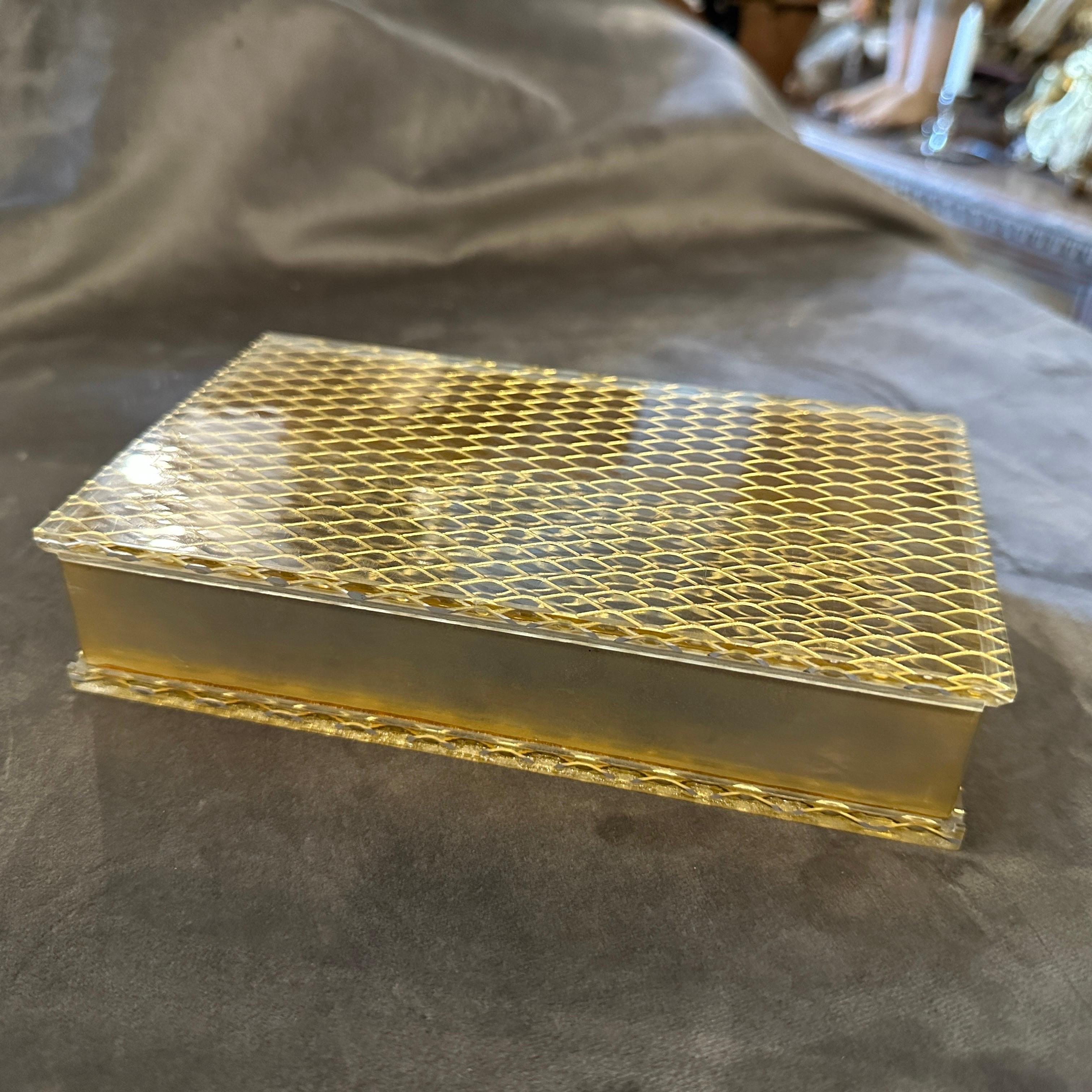 An elegant brass and plexiglass designed and manufactured in Italy in the Eighties, it's in lovely condition. the jewelry box is characterized by use of high-quality materials, geometric design, brass detailing, plexiglass transparency, interior