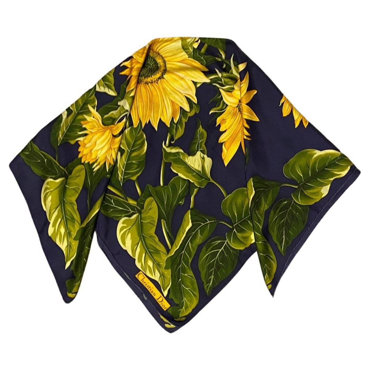 1980s Christian Dior Sunflowers Print Silk Scarf on Blue, handsewn edges, this luxurious and timeless design element will be sure to elevate your wardrobe and add a pop of color to your look.

Condition: vintage, 1980s,very good, minimal wear