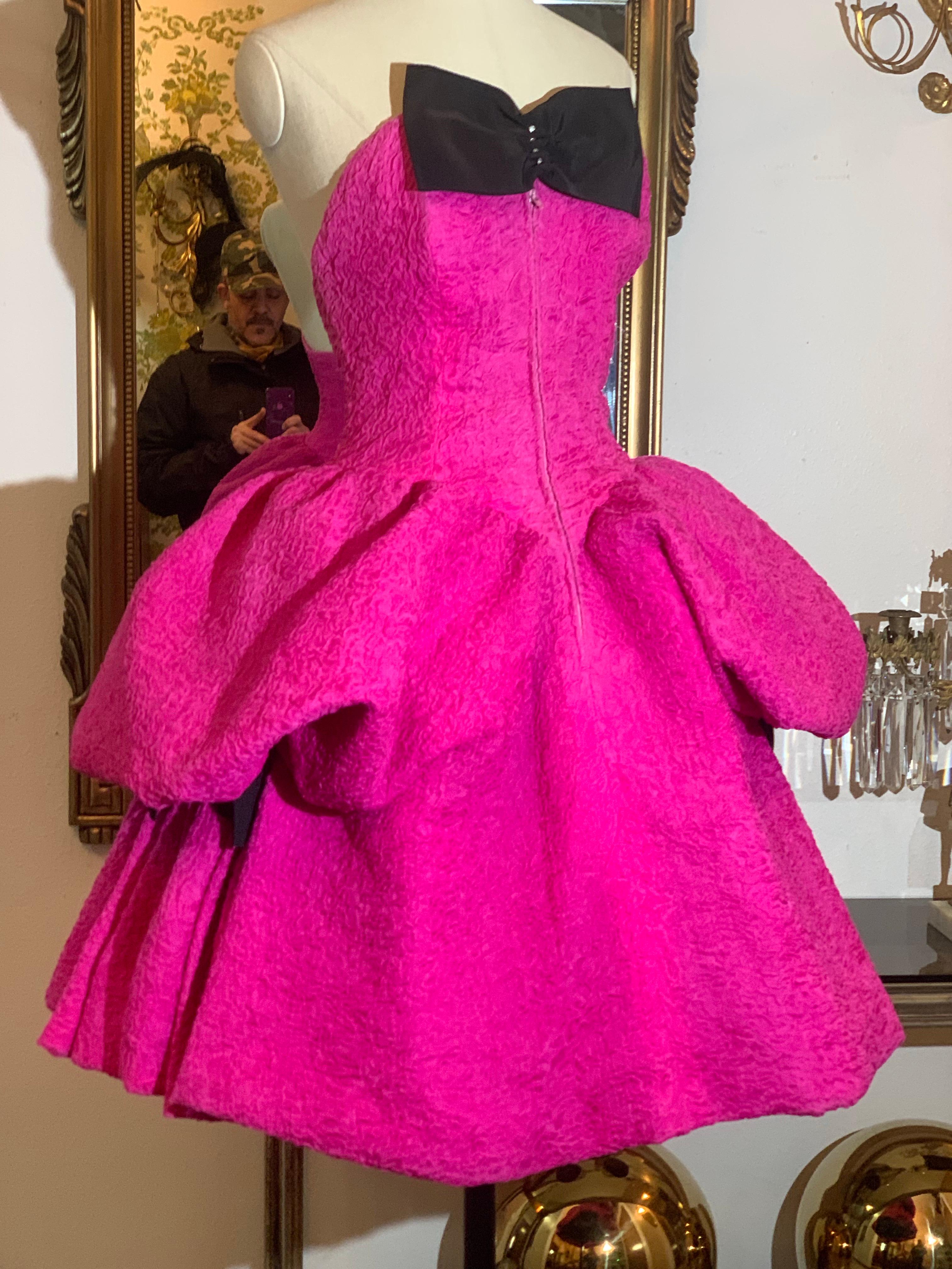1980s Christian Lacroix Haute Couture Shocking Pink Silk Matelassé Strapless Pouf Dress:  A great early example of the Lacroix classic cocktail dress in a vivid pink textured woven silk waffle textured organza.  This unusual dress is unusual in
