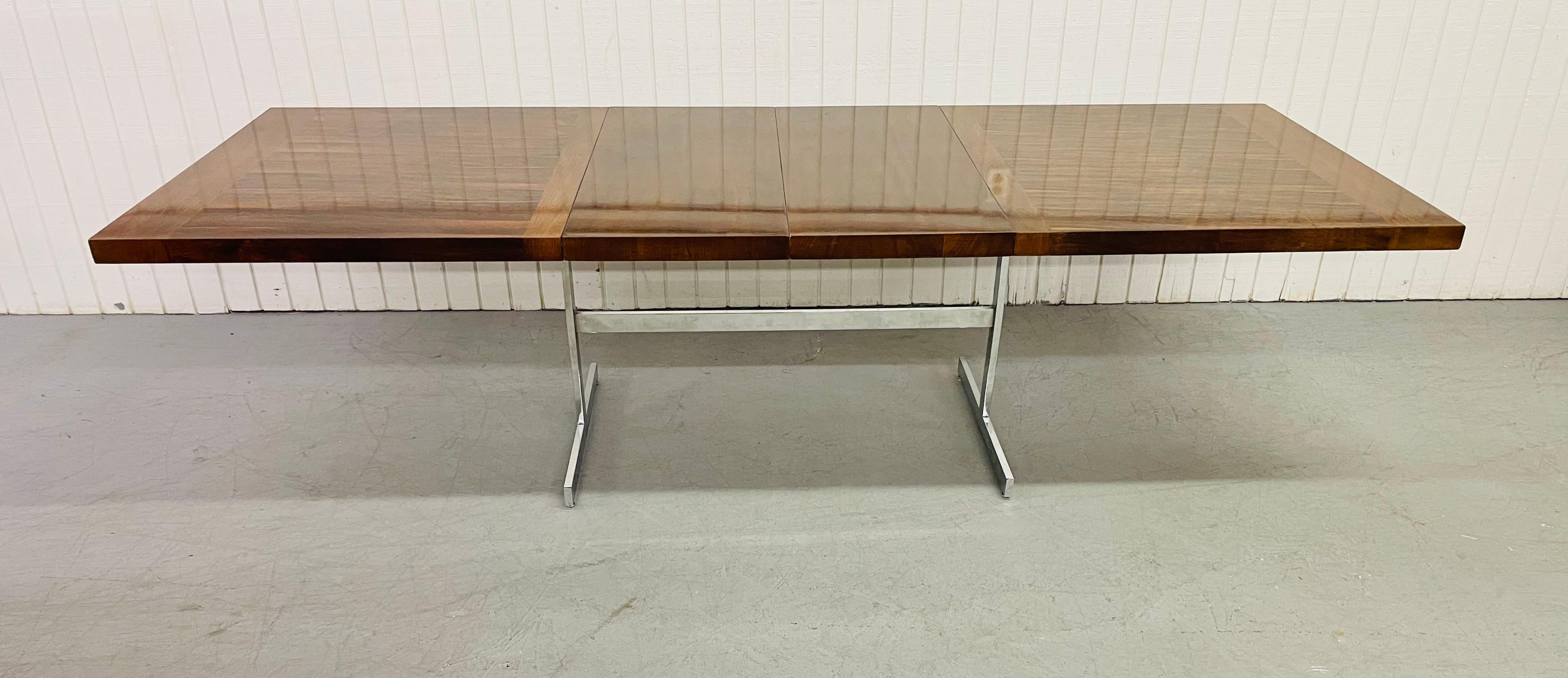 This listing is for a 1980’s Chromcraft rosewood dining table. Featuring a rectangular rosewood top, flat bar chrome base, and two leaves to extend the table up to 108” L!