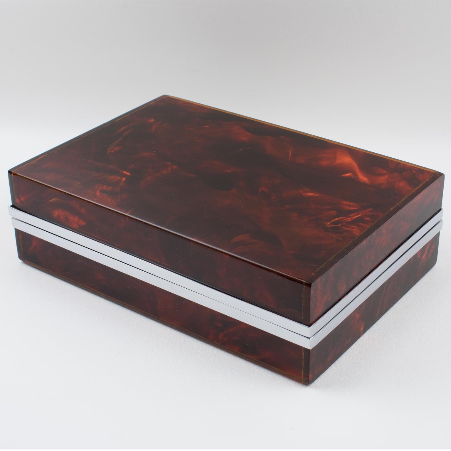 Stunning 1980s decorative lidded box, perfect for living space or vanity. Chrome-plated framing with Lucite in a tortoiseshell (tortoise) textured pattern. Impressive quality, lovely translucent changing pattern. The box hinge can be opened at 180