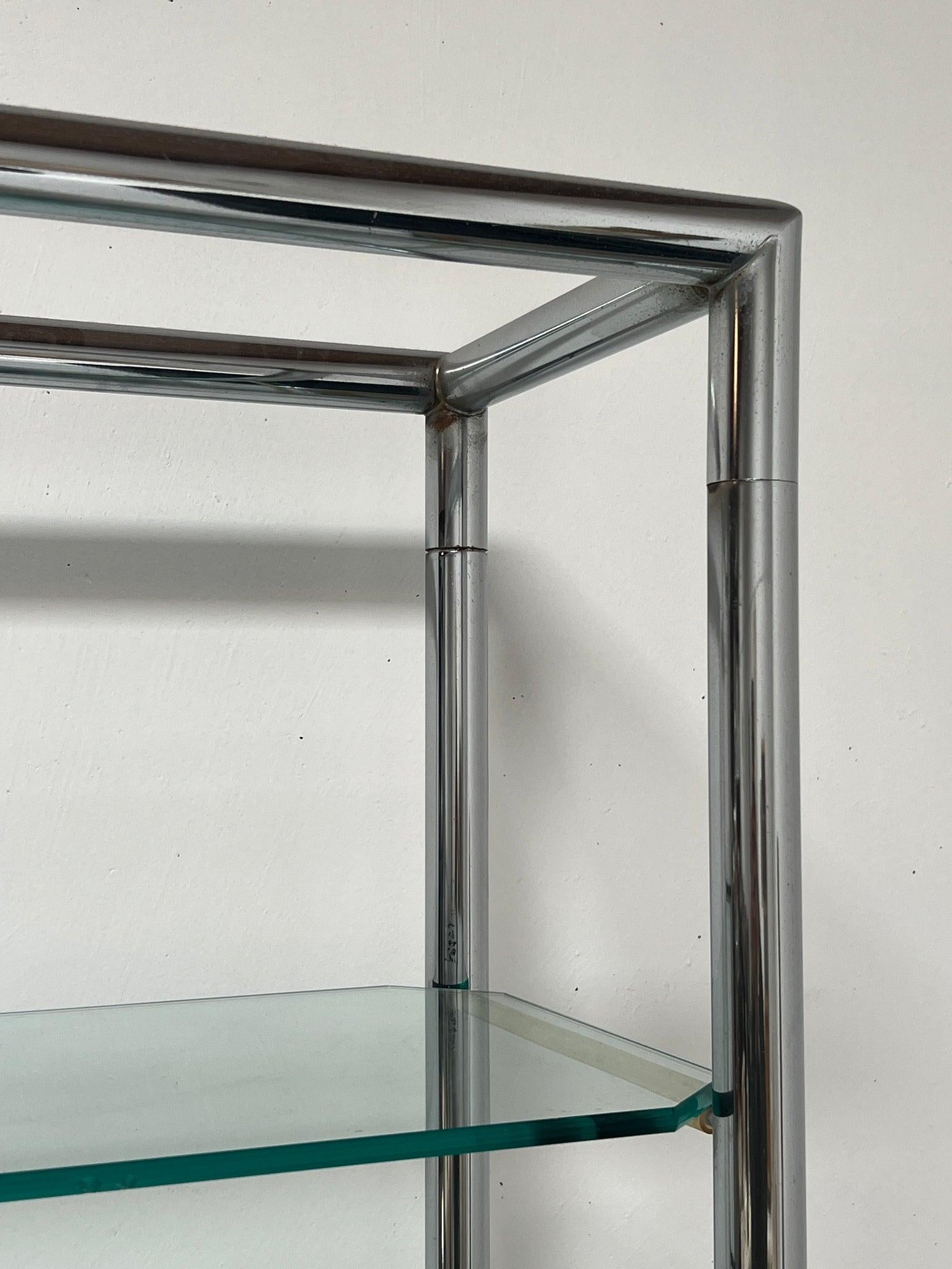 chrome and glass shelving unit