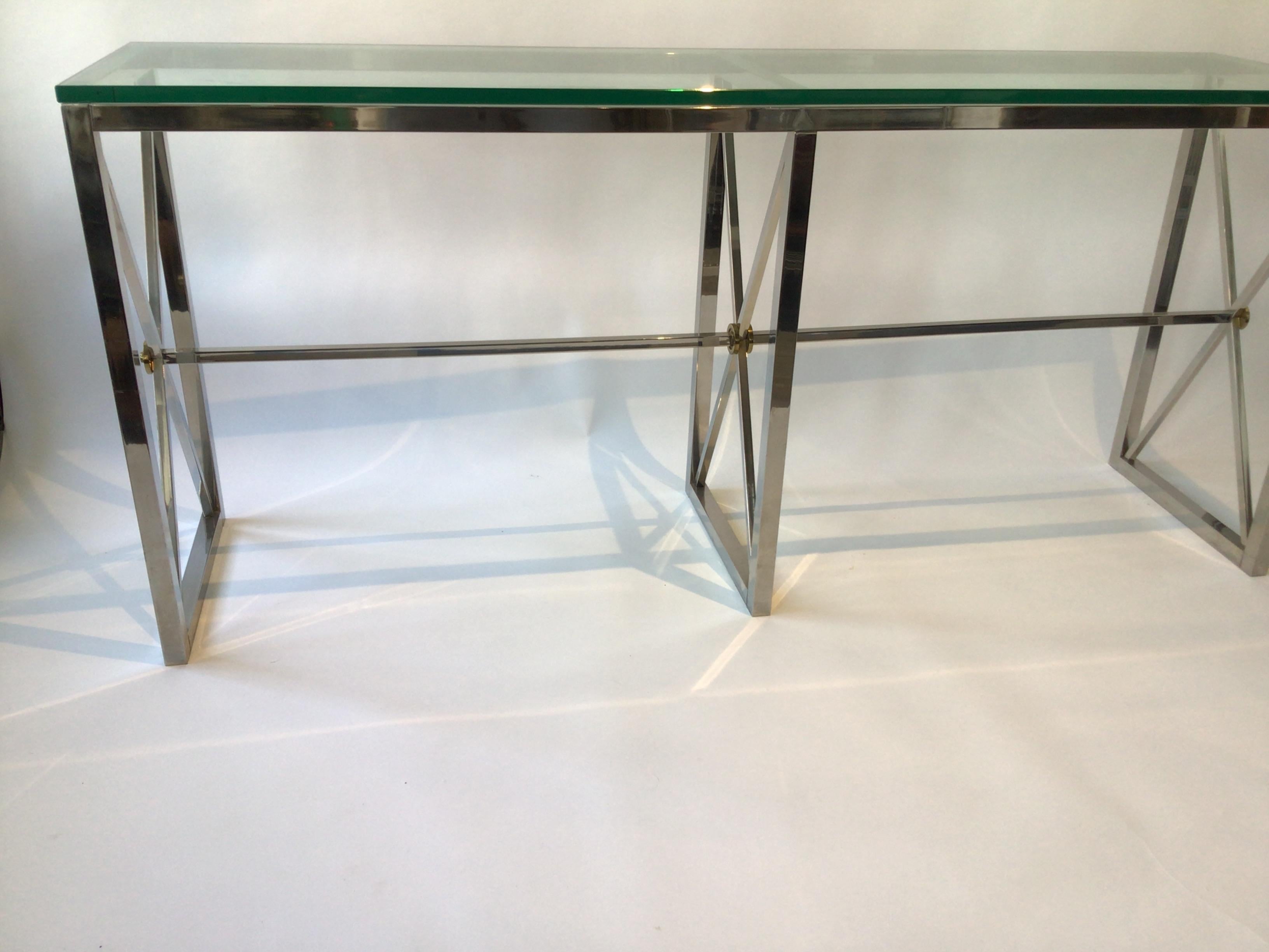 1980s Chrome Neo Classical console. Chrome base, brass accents, thick glass top.