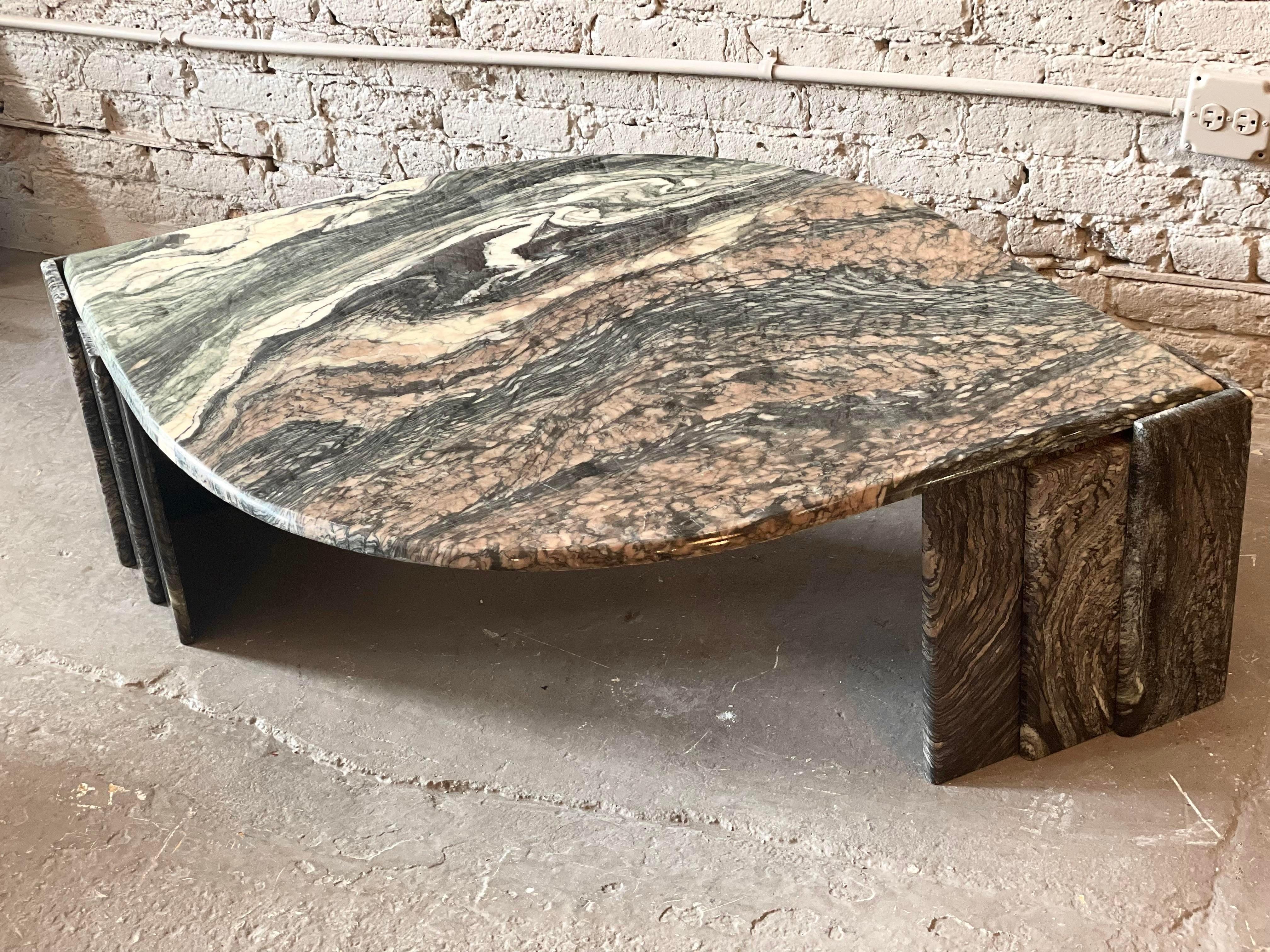 Beautiful beautiful beautiful. My favorite marble in tones of blush black and ivory. Gorgeous veining on this particular table. The top floats on two triangular channeled bases.
 