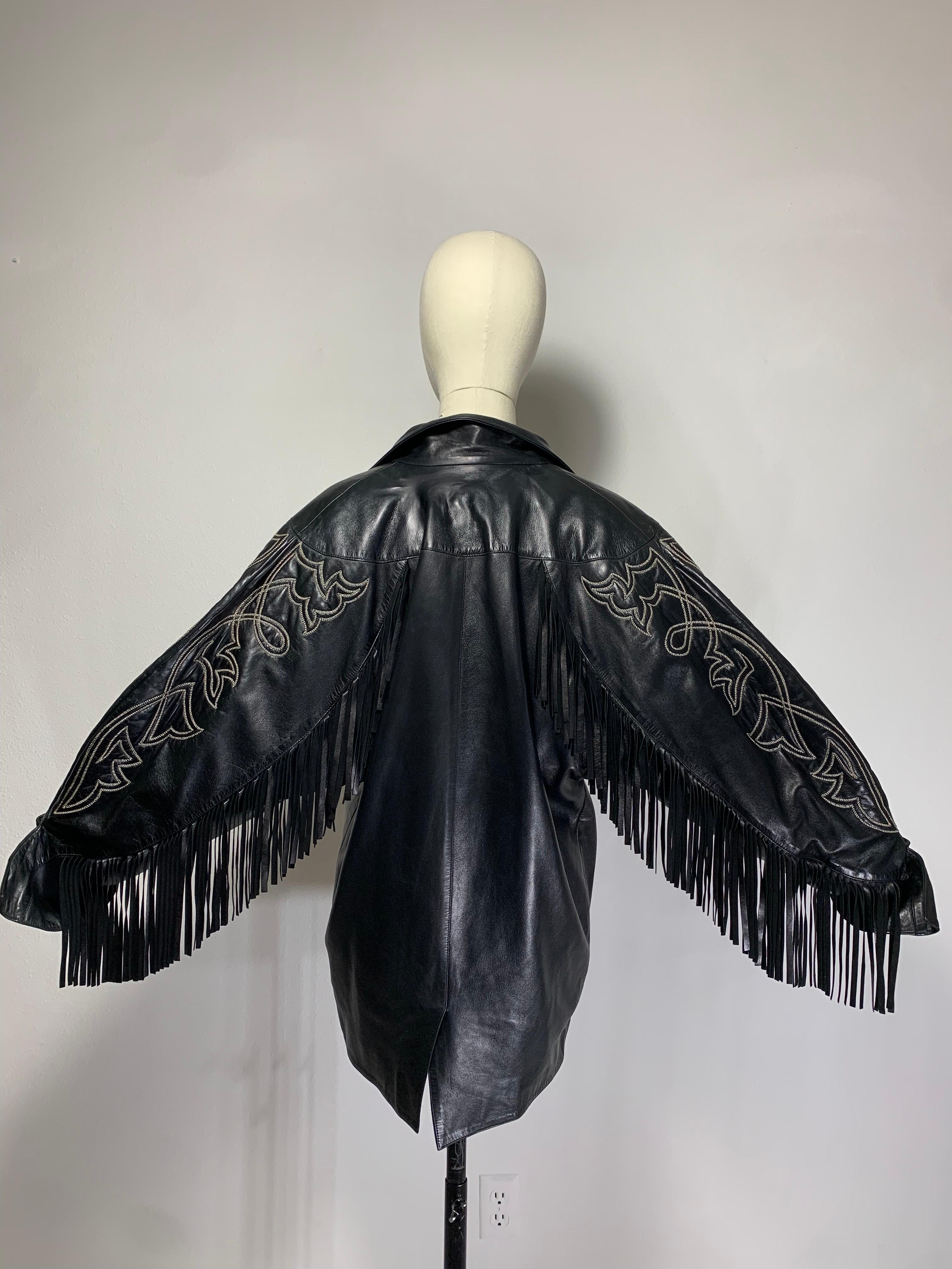 1980s Claude Montana Fine Black Lambskin Leather Fringed Dolman Jacket w Western Stitching:  Fabulous and dramatic styling from a master of outerwear design!  Dolman sleeved jacket with heavily fringed arms and white Western-style stitch designs. 