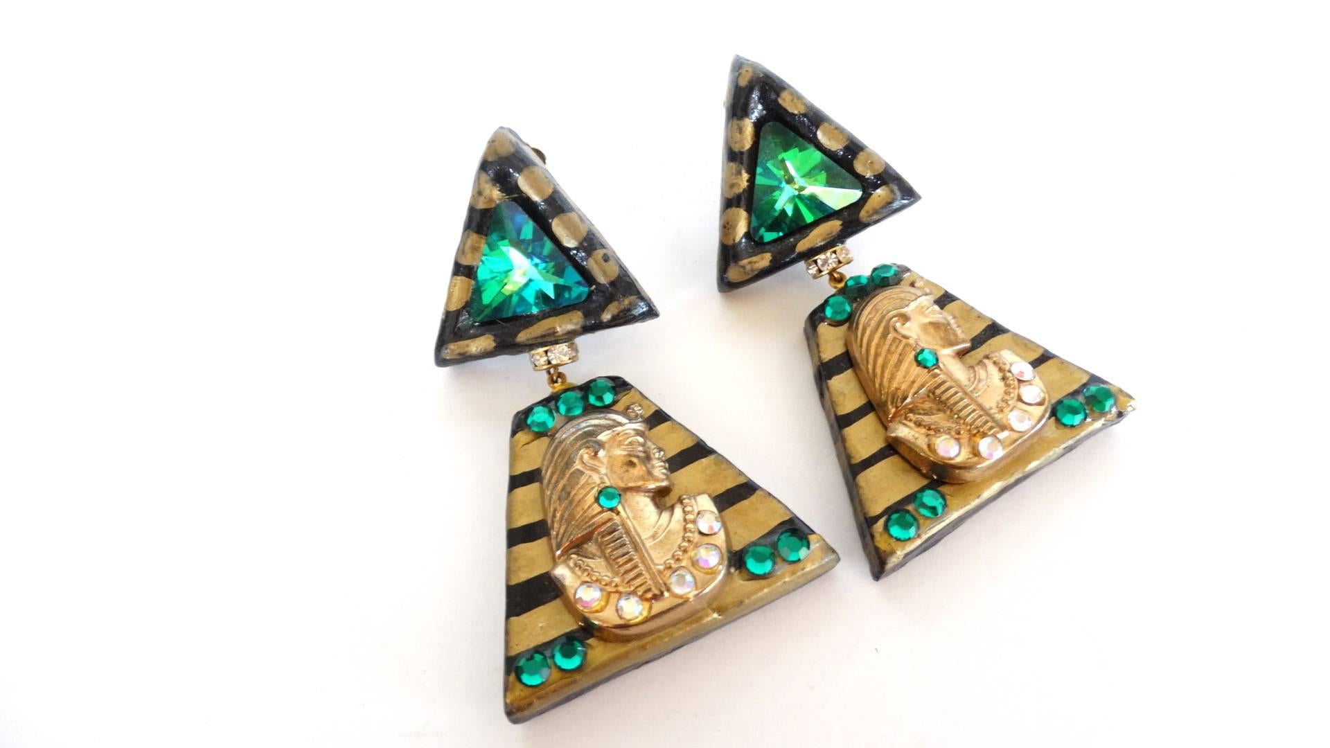 Add a touch of Egyptian Revival to your look, these earrings are fabulous! Handmade earrings with Cleopatra face turned to the side, accented with large green rhinestone. Hand painted design surrounds the beautiful design. Light in weight, signed by