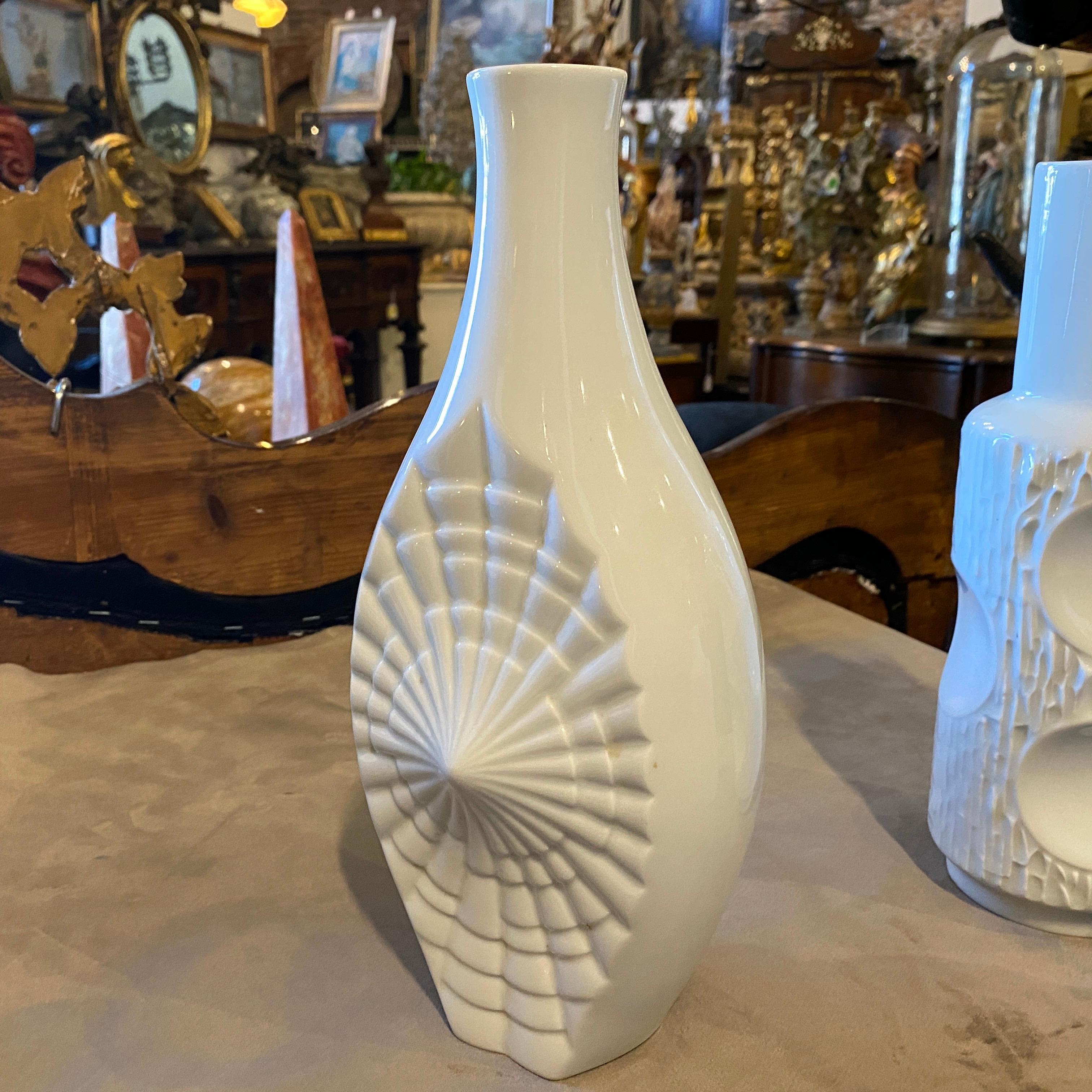 Three white ceramic vases made in Germany, all of them are in perfect conditions and from different manufacturers, height of medium vase is 29 cm, the small vase height is 17 cm