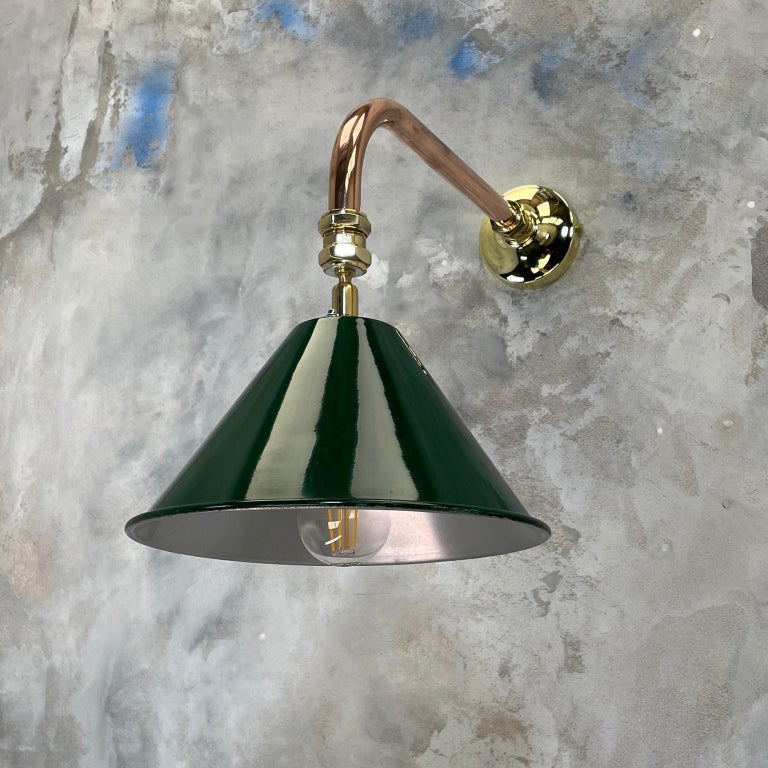 British army tilting festoon lamp shade fitted to a copper and brass cantilever wall fitting to create a bespoke wall light.

Professionally restored and converted by hand in UK by Loomlight to modern lighting standards, ready for contemporary