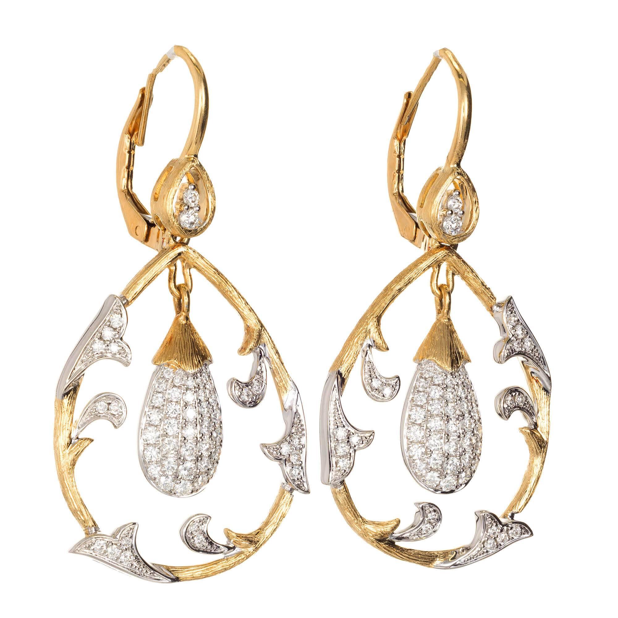 Cordova 1980’s diamond dangle chandelier earrings. 18k yellow and white gold with Euro wire tops.

110 round full cut diamonds, approx. total weight .75cts, F, VS
18k yellow and white gold
Tested: 18k
Stamped: K18
11.9 grams
Top to bottom: 42.76mm