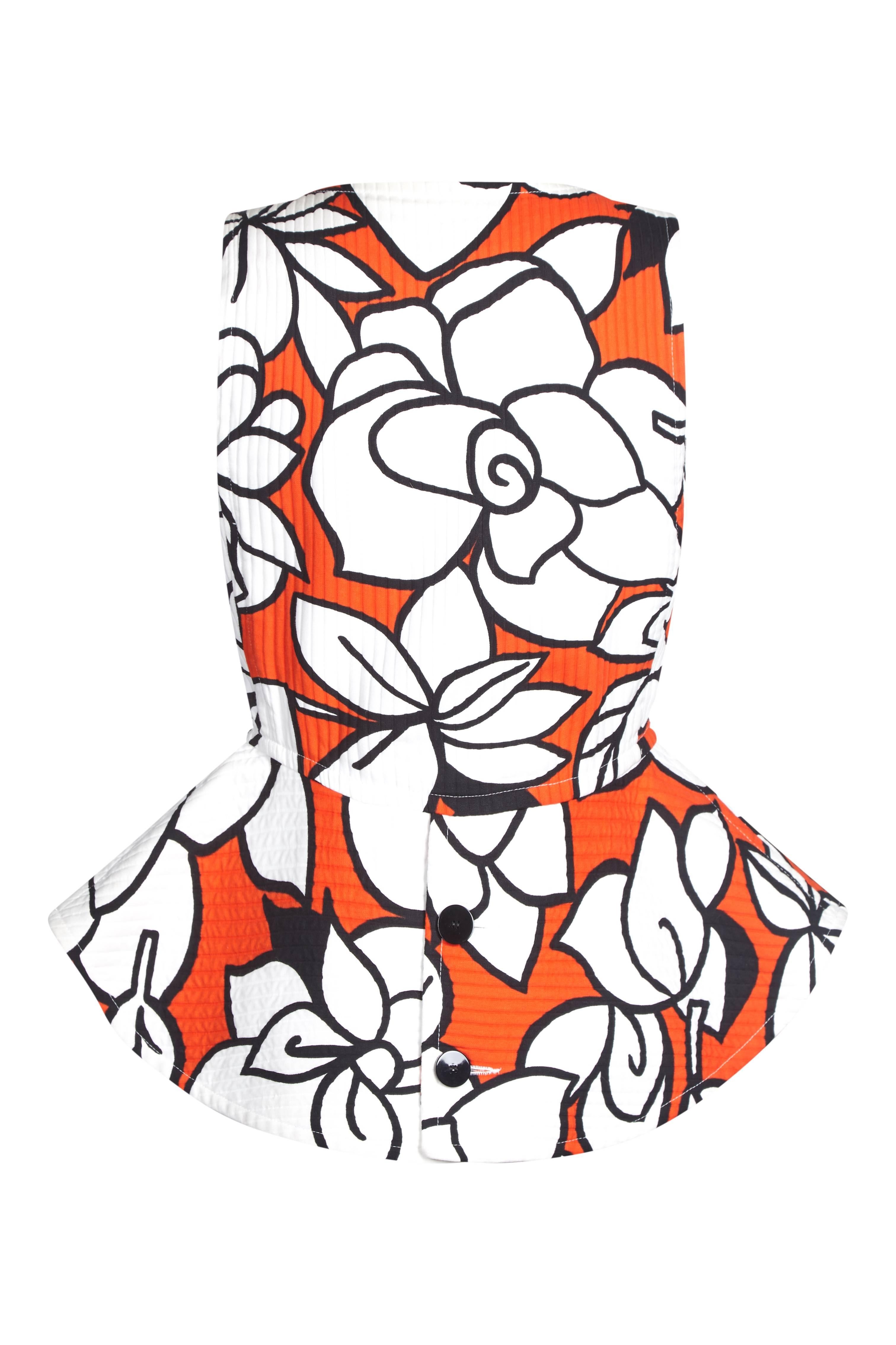 Colourful and graphic 1990s / late 1980s Courreges 'Pop Art' floral print sleeveless peplum blouse. Lovely thick cotton ribbed material with a stiffer peplum in tomato red, white and black. This is an architecturally striking piece, designed to be