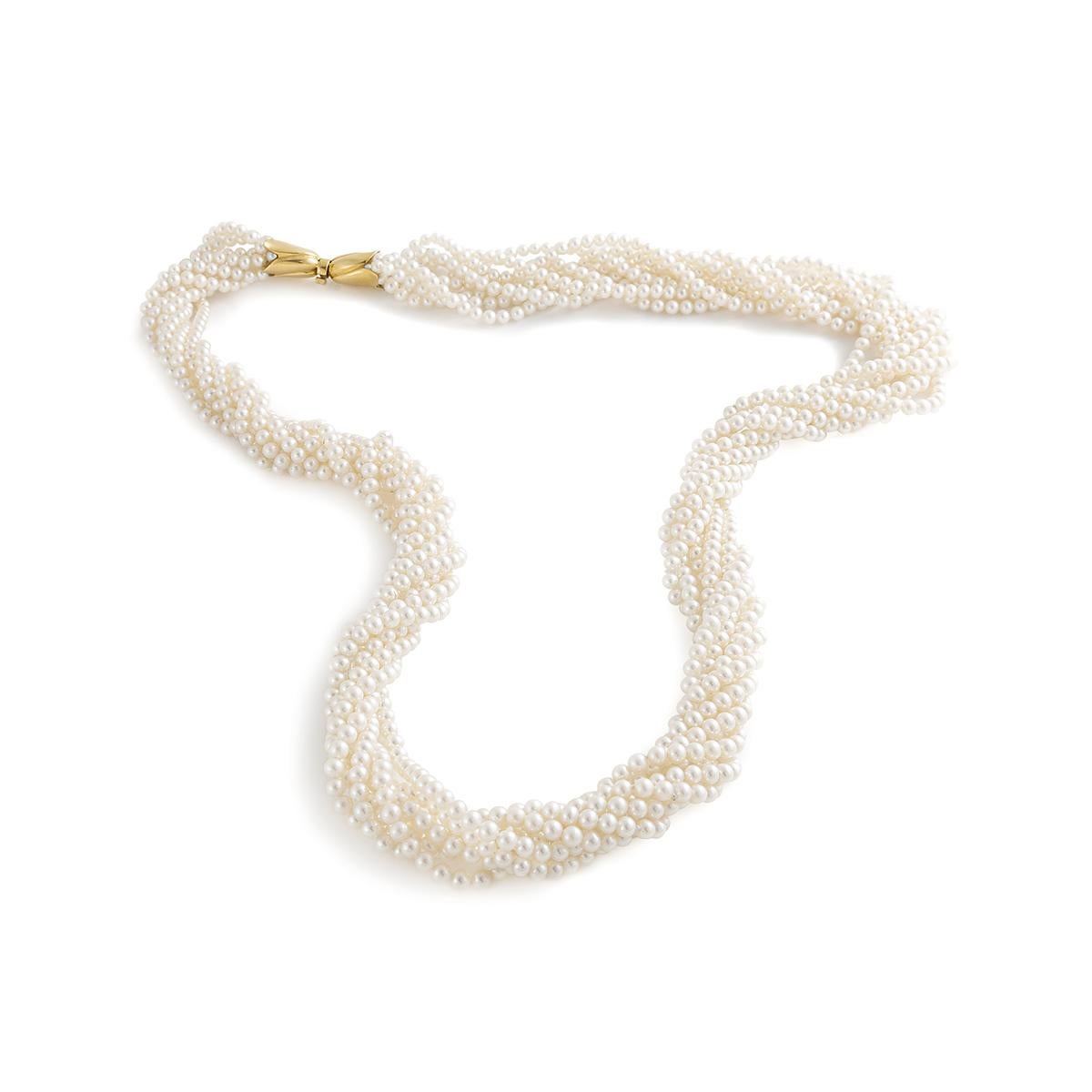 Cultured Pearl yellow gold 18k clasp Sautoir Necklace. Crafted in the 1980s, this piece exudes vintage charm and sophistication.

The necklace showcases lustrous cultured pearls that have been carefully selected for their exceptional quality and