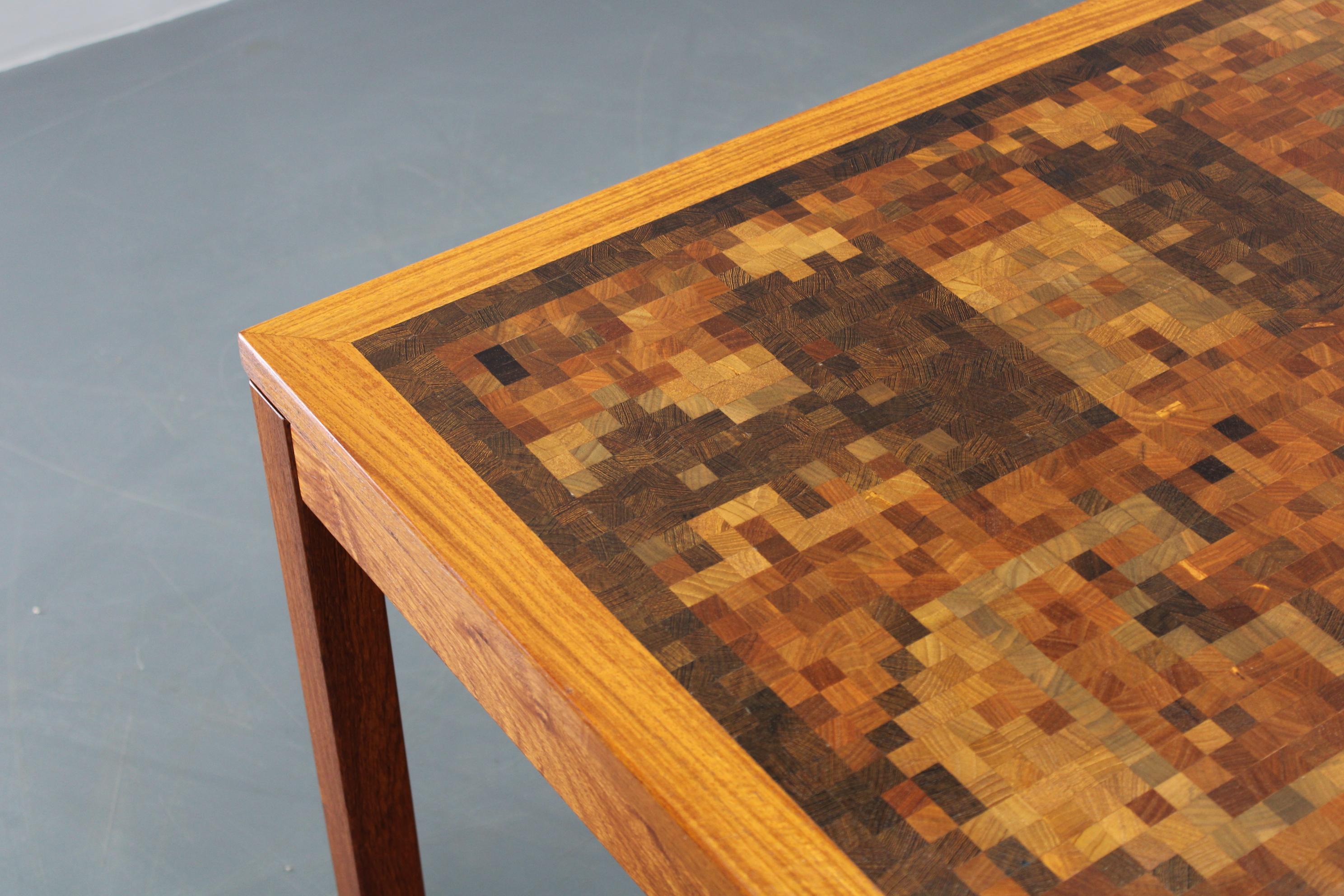 Rare end-grain mosaic coffee table, crafted in Denmark in the 1980s by Rolf Middelboe and Gorma Linduma for Tranekaer, featuring an intricate combination of wood pieces forming a striking pixelated pattern. The generously sized table is labeled by
