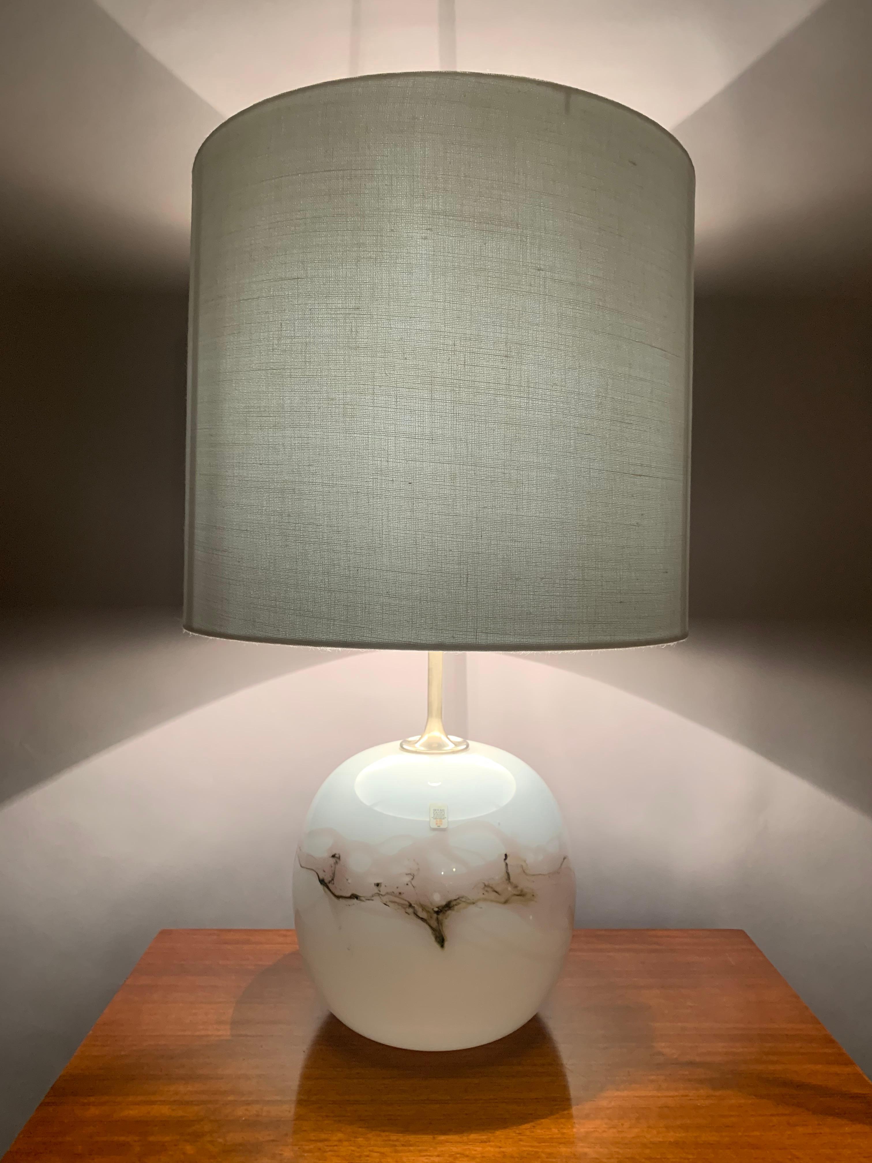 1980s Danish, opaline, art-glass table lamp, designed by Michael Bang for Holmegaard. The lamp was designed for their 'Sakura' design series. An abstract pattern of very pale pink and browns swirls around its circumference. A tall, thin, brushed