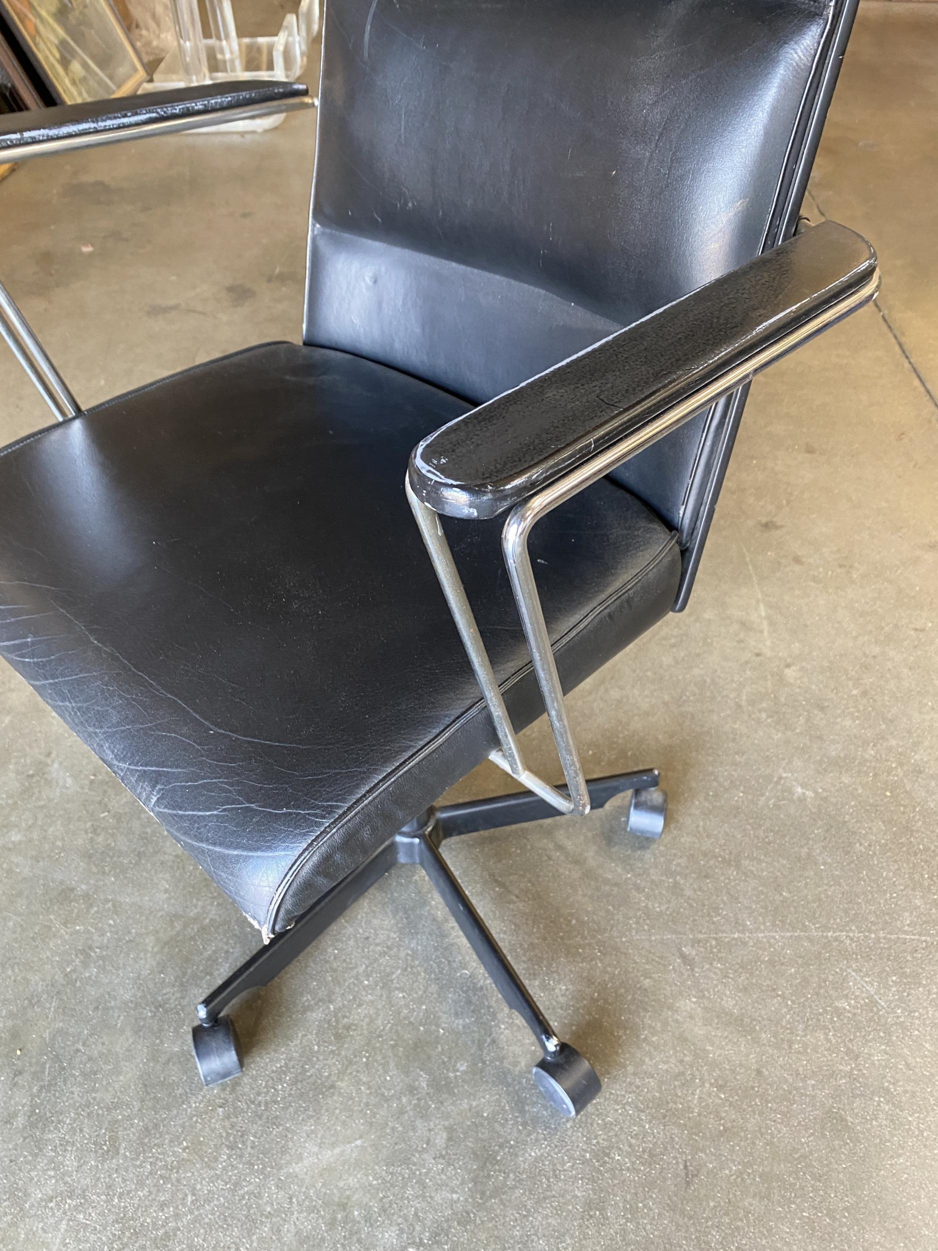 Danish naugahyde office chair designed by Jorgen Rasmussen for Kevi A/S. This piece includes an adjustable seat and backrest with a brown swivel base. 

Circa 1980.
   