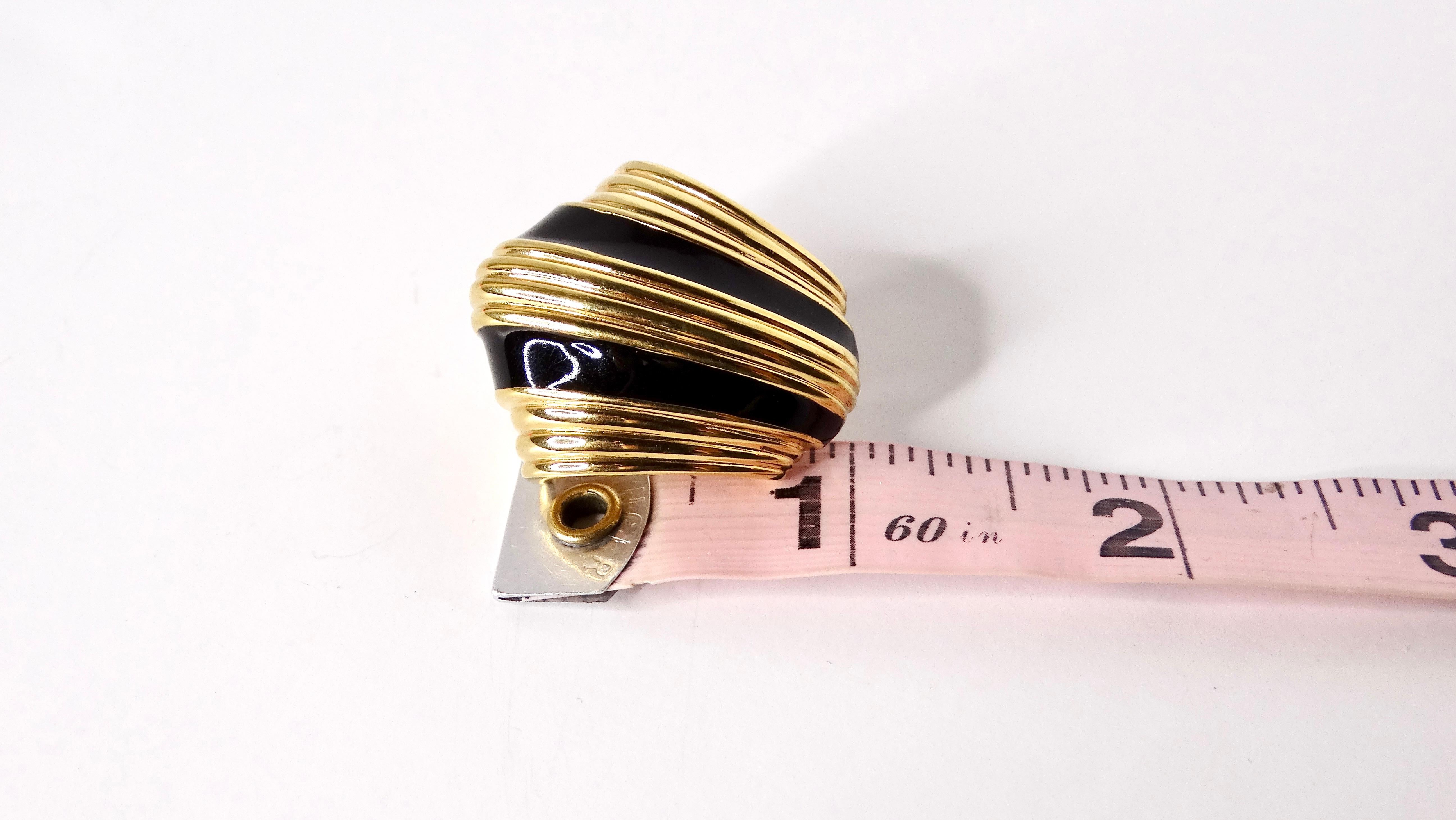 Step back into the glamorous 1980s with these stunning David Webb-inspired black enamel earrings, elegantly crafted with chic 18k gold plating and striking stripes. These eye-catching accessories capture the essence of bold and artistic design