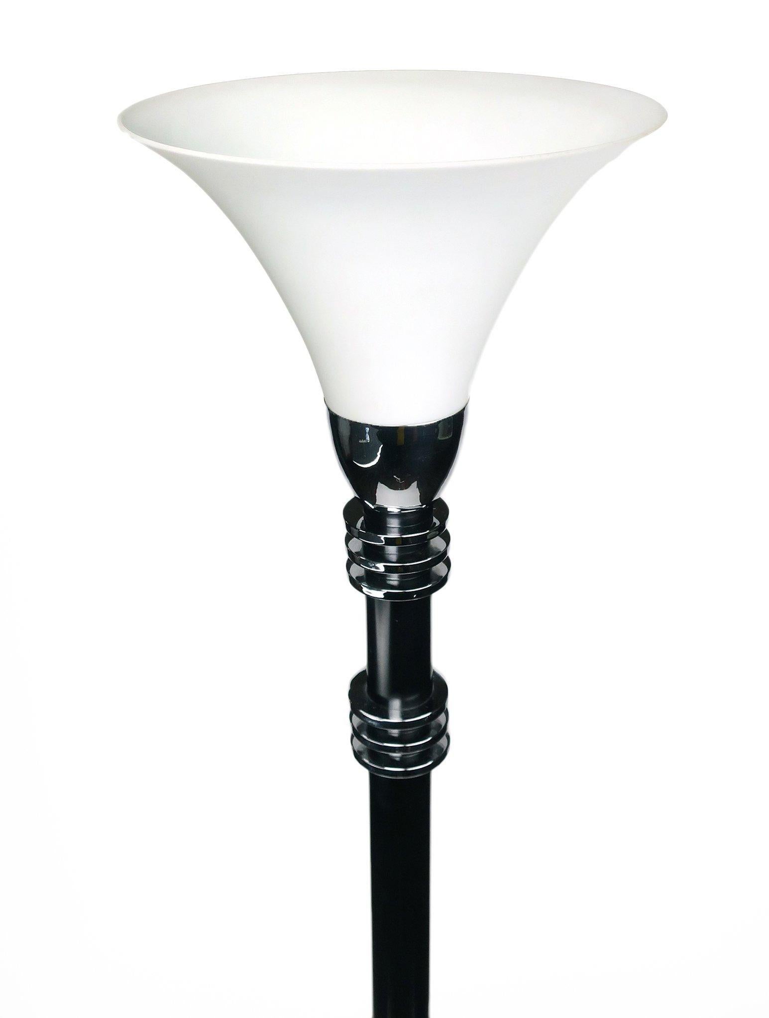 A stunning Jay Spectre designed floor lamp/torchiere for the Paul Hanson lighting company. With a chrome base and accents, black metal stem and white frosted glass shade that evokes streamlined Art Deco and Machine Age design, this torchiere is the