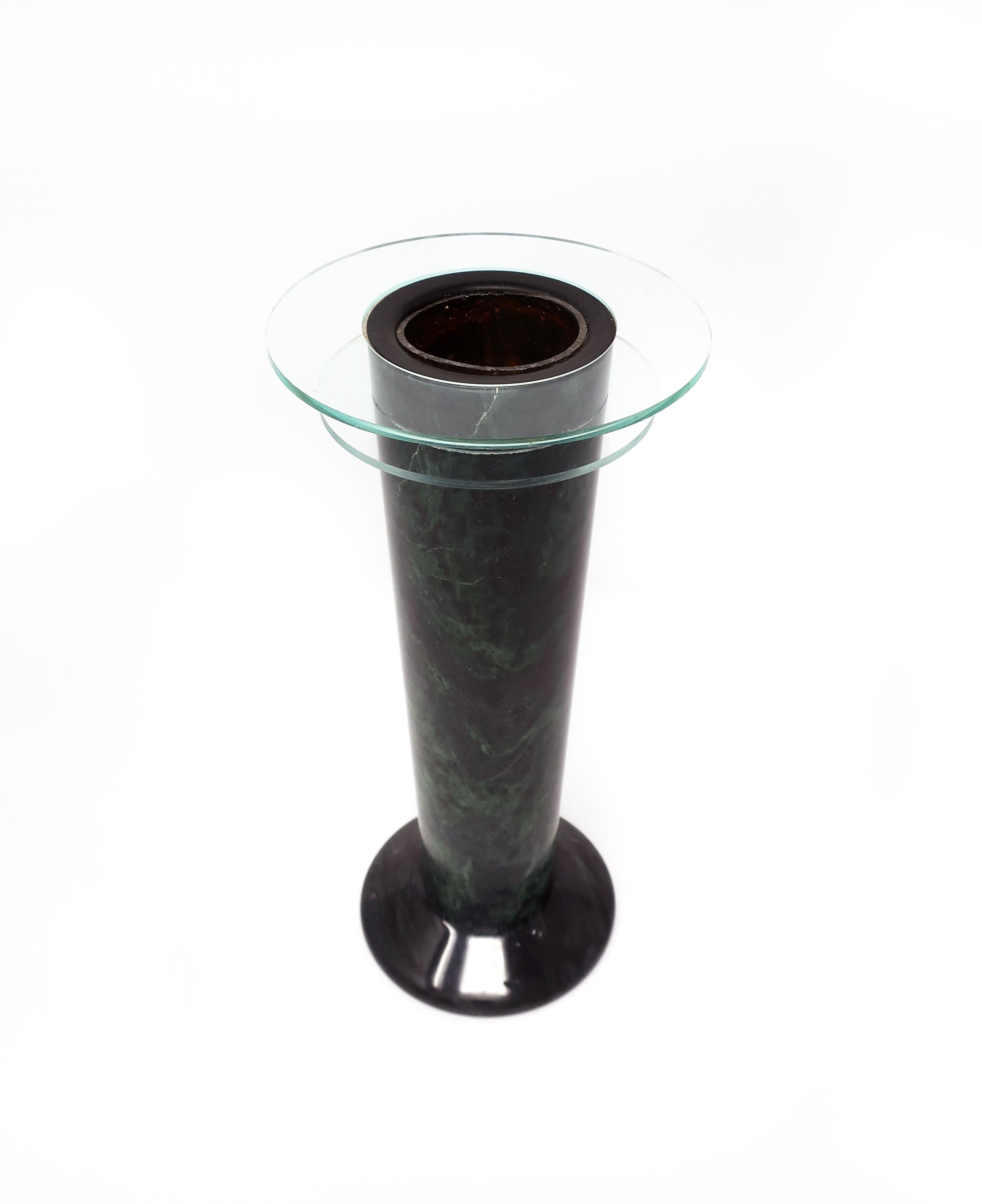 An interesting mix of materials create fantastic lines on this 1980s Art Deco inspired vase. Tapered green marble vase on a dark gray base with one glass ring and one acrylic ring. In excellent vintage condition and lined for use with cut flowers in