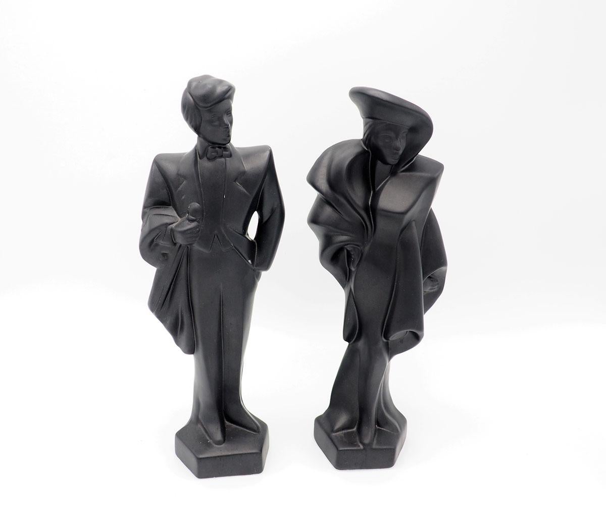 1980s figurines of a man and woman in art deco gala clothes.

The matte black figurines are made of plaster, made in the 1980s.

In the 80s and 90s Lindsay B was a leading Avant Garde artist, these figurines are a popular answer to that.

They were
